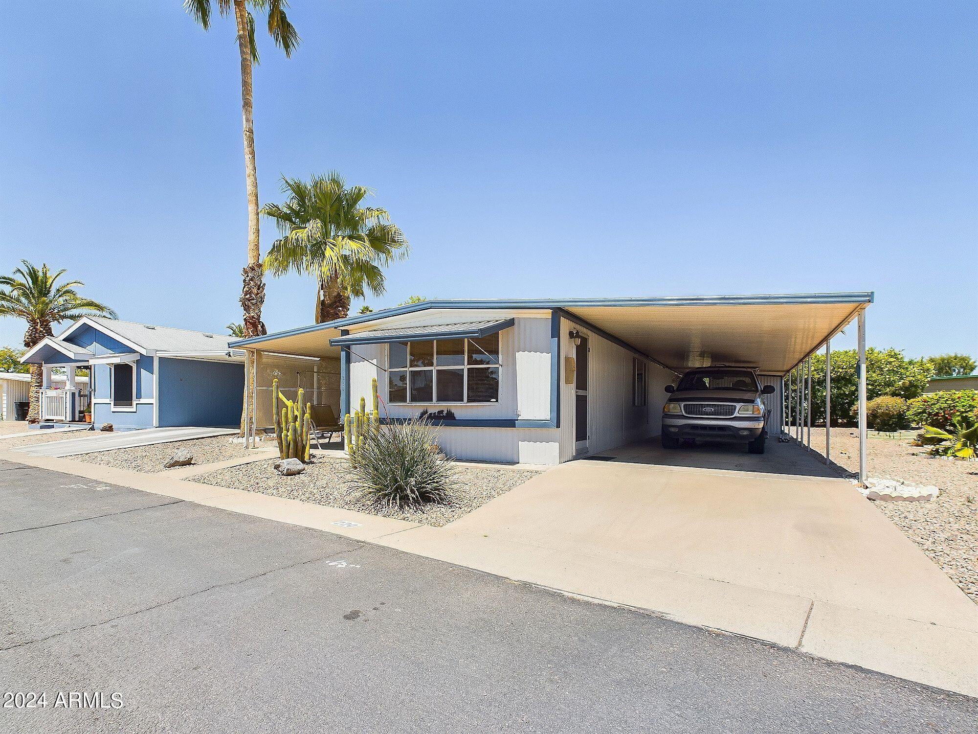 Nice clean single wide priced for quick sale.  It could use a few updates but is certainly livable as is.  Nice laminate throughout, lino in the bathroom.  Kitchen cabinets newly painted and look pristine.  There is an Arizona room and a screened in porch for morning coffee.  This is a 55 plus subdivision, park approval required.  Monthly lot rent with garbage and water is about 1000/month.