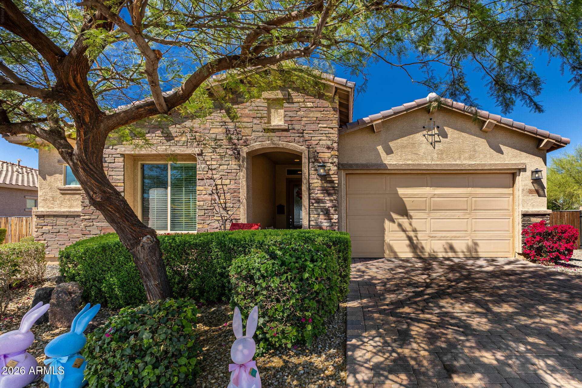 Location, Location, Location! Home sits on a massive 13,167 SQFT Lot! Also has gorgeous Backyard Views of the Mountains with NO Neighbors to the back! Back fence borders count6y owned wash and right of home is a Desert Breeze. Directly across the street is an open field, also owned by the county, and Zanjero Trails Walkway access! Split floorplan with spacious Open Concept. Kitchen features stainless Steel Appliances, Gas Stove, Pot Filler, Huge Patry, and Granite countertops. An absolute Must See!