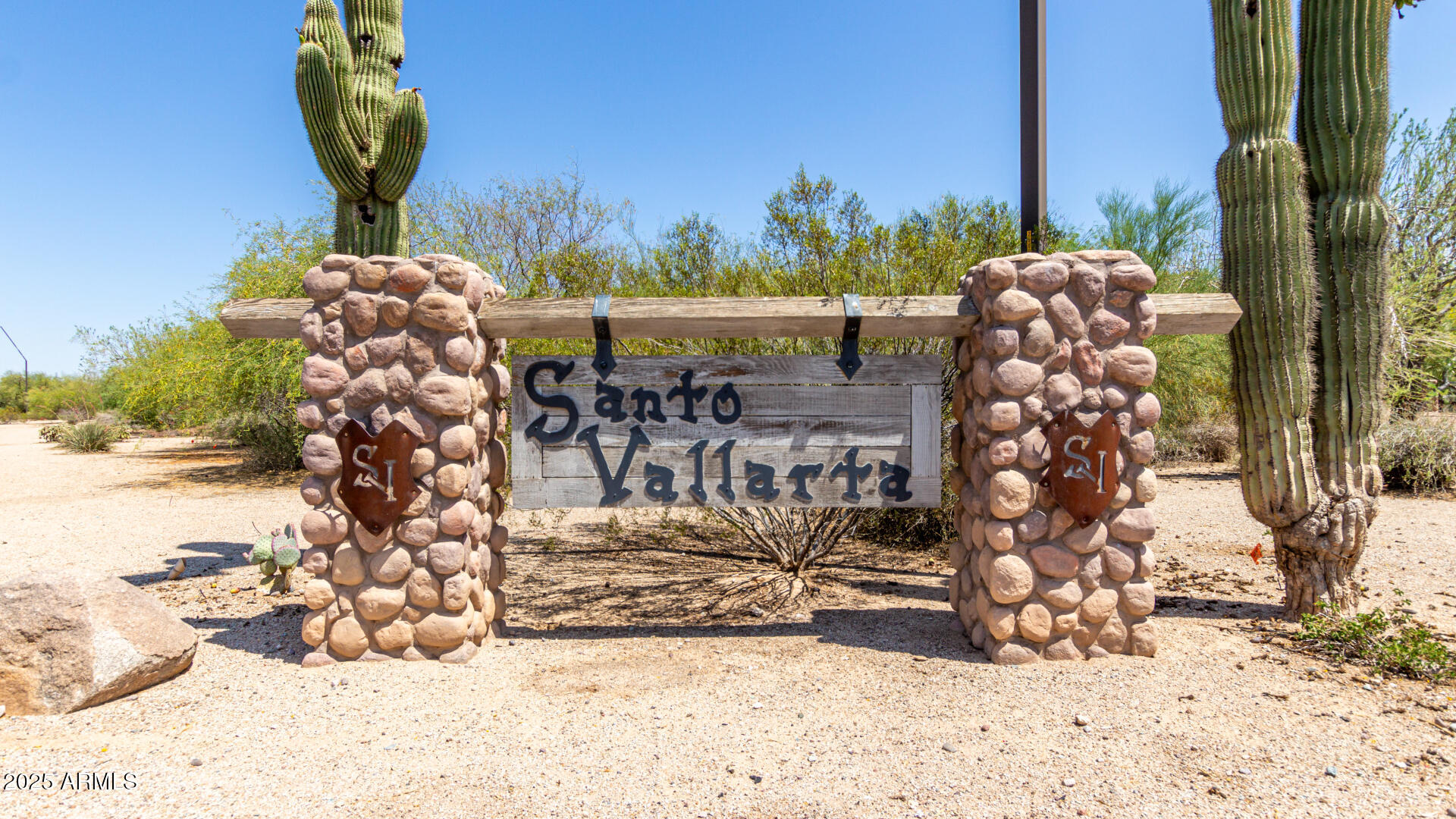 Welcome to Santo Vallarta, a premier gated custom home community nestled in the scenic southeast valley. Surrounded by the serene beauty of the high desert, this exclusive neighborhood offers unmatched views of the San Tan Mountains, the expansive 10,000-acre San Tan Regional Park, and the iconic Superstition Mountains. Enjoy breathtaking sunsets and sparkling city lights after dark. The peaceful setting and striking natural landscape make this a truly exceptional place. Conveniently located just minutes from shopping, dining, and entertainment, this is where luxury living meets natural beauty.