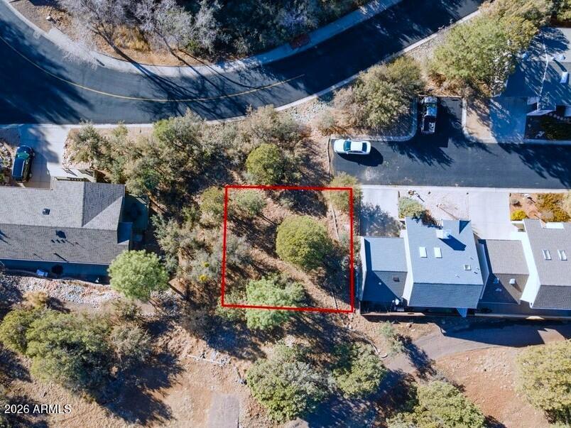 Plans with Purchase! City Lot! Set at the end of the cul-de-sac, this treed property with views is waiting for you to build your Townhome. Ideal in-town location for Primary Residence or Weekend Getaway! 1 mi to Courthouse Plaza and walking distance to Dining & Entertainment. City Water & Sewer available.  Plans for 1282 sf, 3 bed, 2 bath home.  See photos for floor plan.  Come by and take a look!