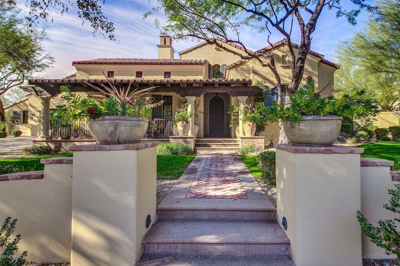 I was always taught to buy the home the builder built for himself. This is the home that Anthony Salcito built for himself and you can see it. This home has a timeless design with only the top of the line finishes that will be the envy of all your friends. Backing to the wash you have incredible views along with peace and quiet. The pictures are great but do not do this home justice. From the light kitchen to the incredible master suite located downstairs with three walk in closets, sitting room and separate bedroom you will fall in love with the design.  The upstairs has 2 bedrooms and a TV area that could also be a game room. The Ralph Lauren theater is to die for and the back yard has a huge lap pool and spa and is low maintenance with artificial turf.