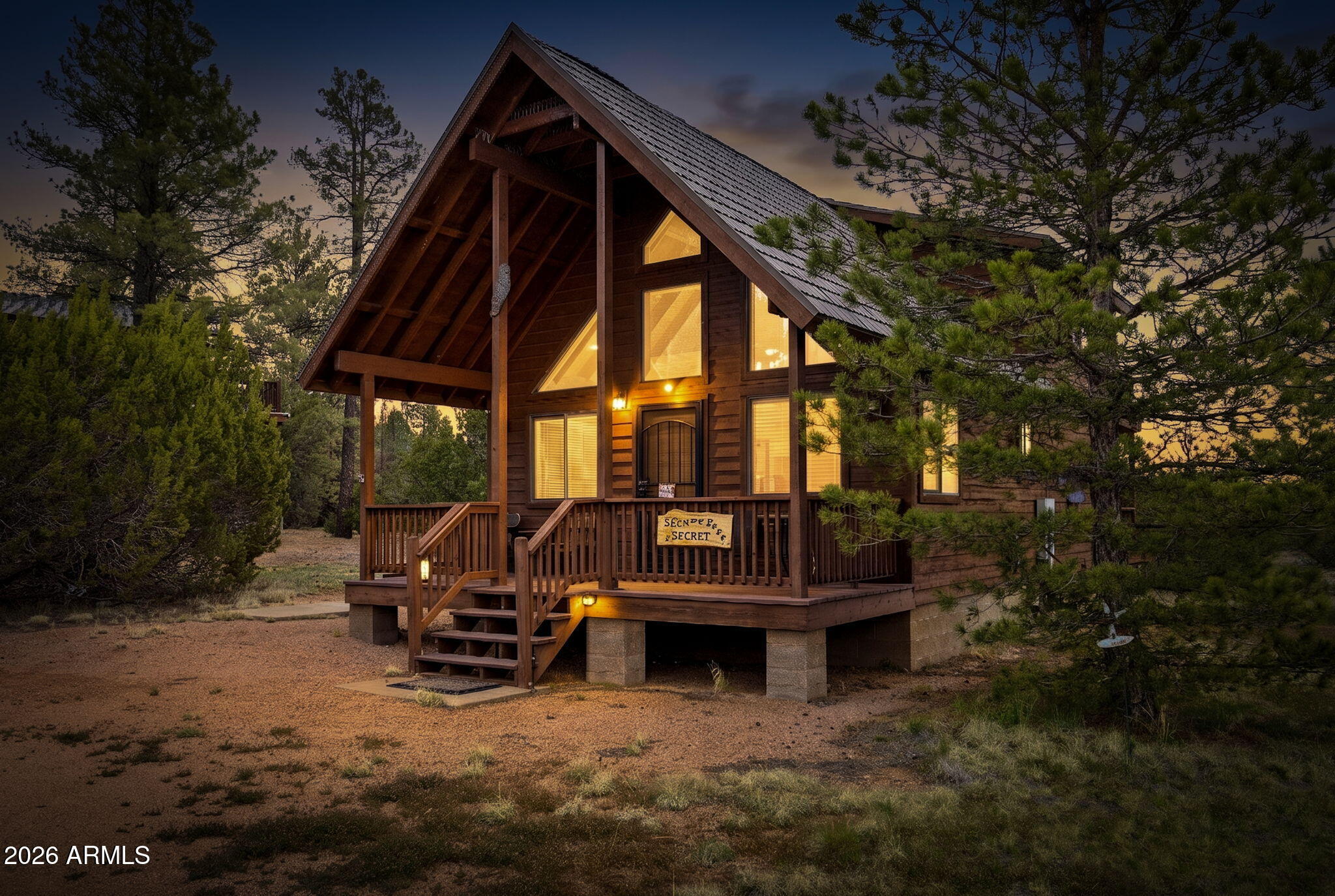 This charming two story cabin is offered fully furnished and move-in ready. Enjoy the beauty of the outdoors from 3 separate decks, including 2 rear decks that overlook the national forest as well as adjoins. Inside, you're welcomed by soaring tongue & groove vaulted ceilings & a cozy gas fireplace. The kitchen has been tastefully updated with granite countertops and newer appliances, making it both functional & inviting. The main floor features a comfortable primary bedroom, a full bathroom with granite & a convenient laundry area with washer and dryer. Upstairs, the spacious loft serves as a second bedroom, offering privacy for guests along with access to its own private deck, perfect for stargazing. Additional highlights include a durable metal roof & a large storage shed.