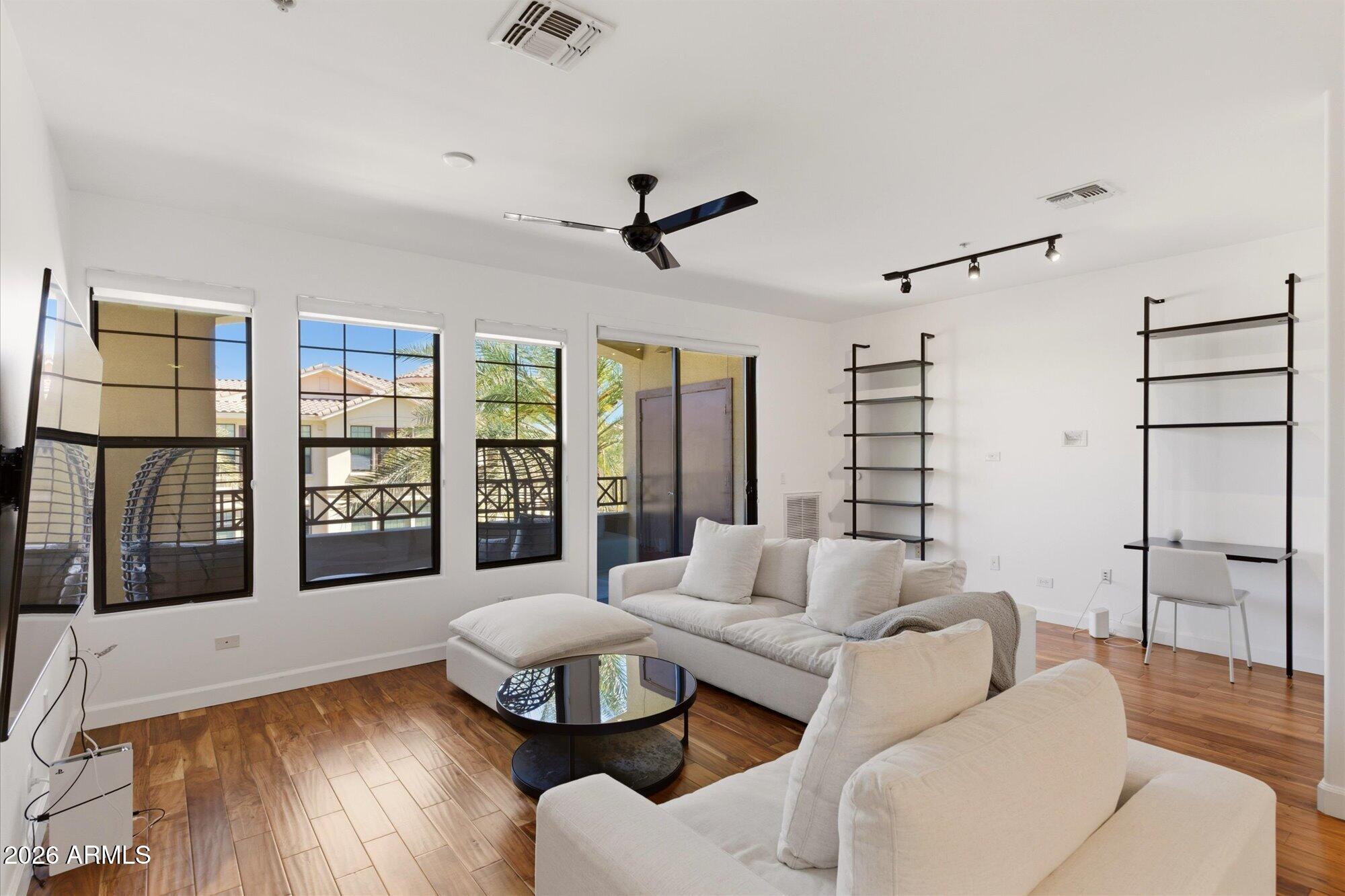 Very motivated seller!!! Enjoy resort style living in this beautiful condo, just minutes from Old Town Scottsdale, dining, shopping, golf and entertainment! This spacious 1 bedroom, 2 bathroom residence features an open layout that provides a generous living and entertaining space. It's complemented by abundant natural light and a seamless indoor-outdoor feel. Enjoy a cup of coffee in the morning or a glass of wine at night, on your balcony overlooking the gorgeous pool area! This is a perfect full time residence or lock and leave opportunity, don't miss it!