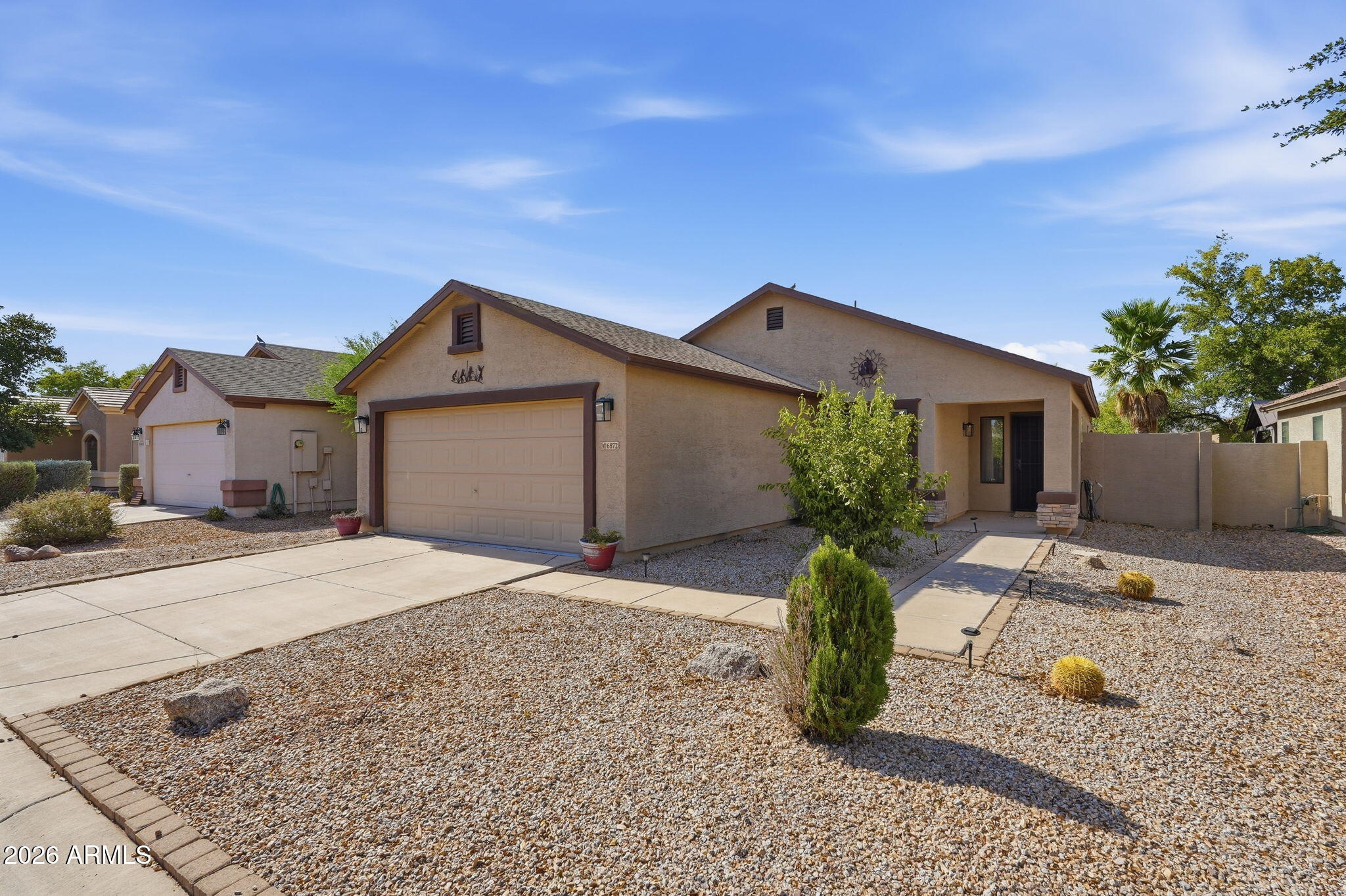 What a beautifully maintained home in the desirable Magic Ranch community in Florence. This move in ready property offers an open concept great room layout with granite countertops and stainless steel appliances. Tile flooring in all high traffic areas, spacious primary suite with a walk in closet. Step outside to your private play pool, covered tiled extended patio and low maintenance landscaping. The fully OWNED solar system helps keep utility bills as low as $20/month. All furnishings shown in the home (sofa, hutch, faux fireplace and 2 TVs) convey with purchase. This is an exceptional opportunity for a primary residence, winter retreat or investment property. Conveniently located near parks, schools, and community amenities.