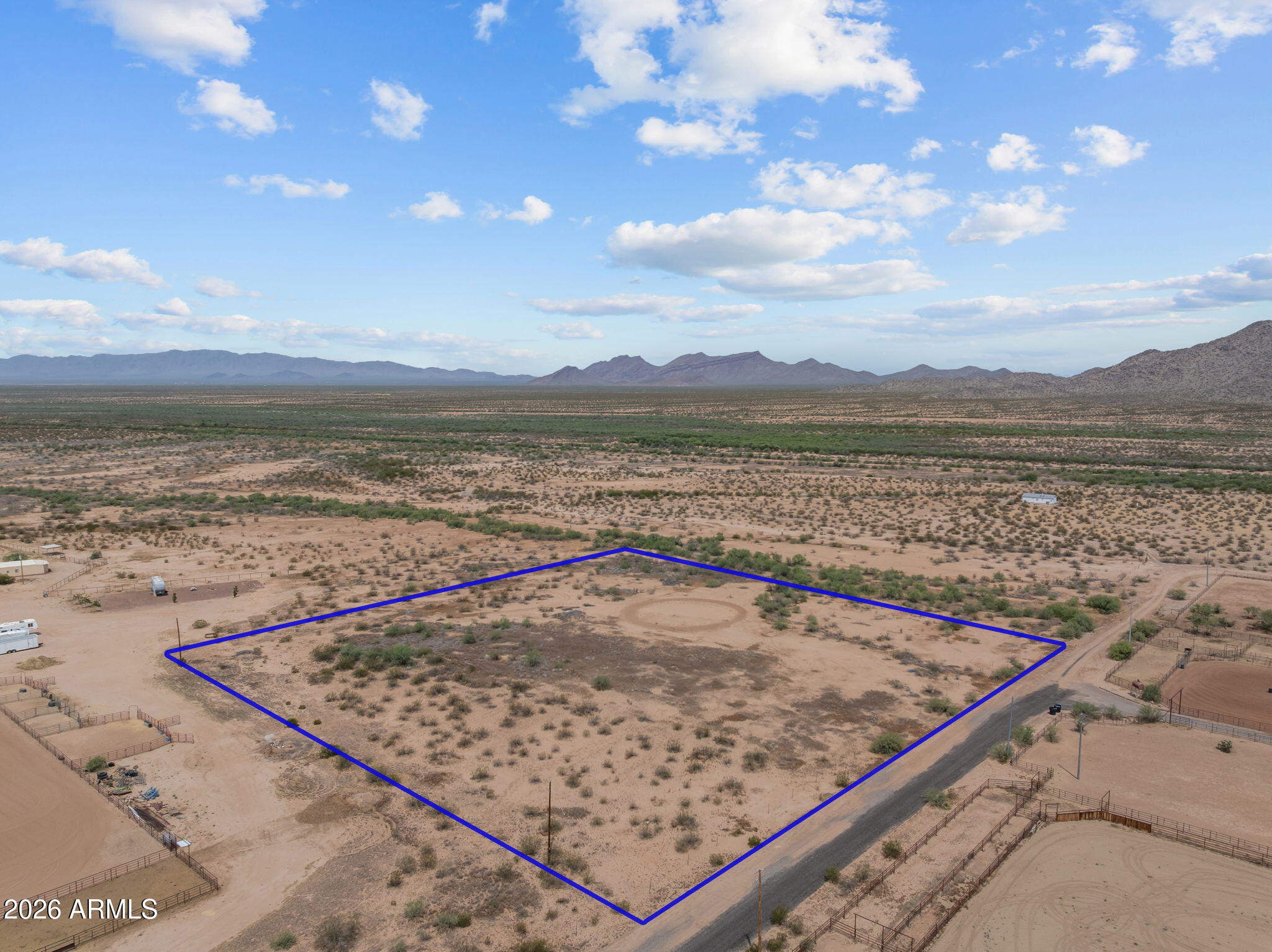 Welcome to this beautiful 5-acre parcel offering flat, fully usable land in a desirable horse-friendly area with no CC&Rs and endless potential. Build your dream horse setup with room for an arena, barn, pens, shop, trailer parking, and custom home. The property is fenced with wire fencing and offers a great start for future improvements. Enjoy the convenience of a shared well, power nearby, and State Land close by for riding, recreation, and open Arizona views. A rare opportunity to create your own horse property exactly the way you want.