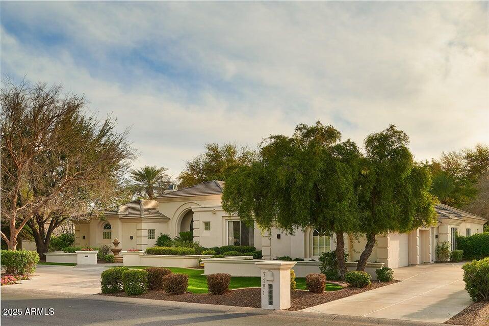 Experience unparalleled luxury in this single-level, updated residence within guard-gated Cheney Estates, $1mil+ spent in updating, Situated on a oversized lot (29,901 sqft). Impressive Front doorway to 16ft ceilings, formal entryway leading to an formal living & dining room to an open floor plan that includes a great room. The epicurean-inspired kitchen is equipped w/ high-end appliances, dual ovens, a large walk-in pantry, & White Caesarstone countertops, all complemented by extensive bar seating.  150+ bottle wine cellar, Private sanctuary awaits in the split-plan primary suite, featuring a dual-sided fireplace, a seating area, and a lavish ensuite bath with separate his-and-hers Vanities & closets. The home is completed by a children's or guest wing w/ four separate ensuite bedrooms Step outside to discover mature landscaping, a backyard oasis designed for leisure & enjoyment offering a magnificent pool & spa, sport court & Ramada. This exceptionally bright and sophisticated home defines estate living at its finest. Circular drive, long driveway to a large 3 car garage with Storage. 2 new Tankless hot water heaters.