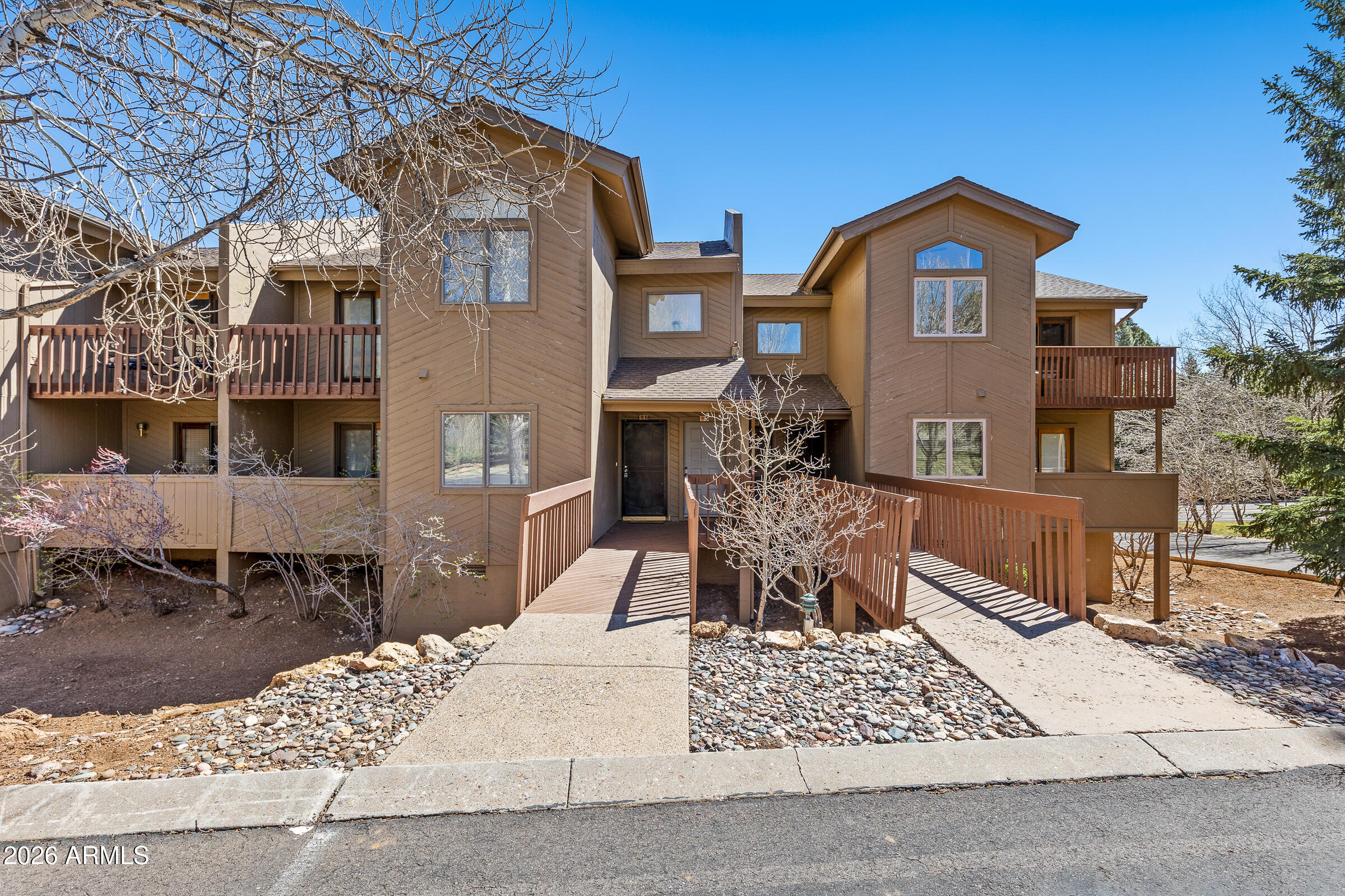 Welcome to this thoughtfully maintained 2-bedroom, 2-bath condo in the highly desirable Continental Country Club. The living space is warm and inviting, centered around a cozy fireplace that adds the perfect mountain touch.

The main living area opens to a private deck, offering a peaceful spot to relax and take in Flagstaff's cool evenings. The kitchen features a functional layout with ample cabinetry and storage, making everyday living easy.

The primary suite offers patio access and serene views, creating a quiet and comfortable space to unwind. A well-designed floor plan provides flexibility whether you're living here full time or using it as a getaway.

Residents enjoy access to golf, a clubhouse, pool, tennis courts, and nearby trails, all just minutes from shopping dining, and downtown. Offered fully furnished!