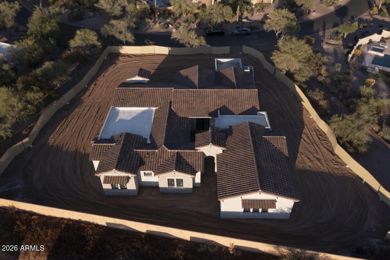 Under Construction-Completion June 2026. Perfectly Positioned to Capture Breathtaking Superstition Mountain Views, this Exceptional Custom Estate is Located within the Prestigious Gated Community of Superstition Mountain Golf & Country Club. The Casita w/ Private Entry is ideal for accommodating Guests and Floorplan is Designed for seamless Indoor-Outdoor Living. The Home Features Expansive Andersen Windows, Retractable Glass Sliders, Courtyard and Four Fireplaces. The Chef's Kitchen Showcases Wolf and Sub-Zero Appliances, Built-in Warming Drawer and Coffee Maker, Custom Cabinetry, Quartz Countertops, and an Oversized Waterfall Island. Complemented by a Hidden Butler's Kitchen, with Bosch Appliances, and an Integrated Laundry Room. Additional Highlights include a Personal Sauna, Spa-Inspired Custom Tile Shower, Master Bedroom Safe, Foam Insulation Electric Vehicle Charging Station, Dog washing station and etc. Beautifully Landscaped with Exceptional Curb Appeal, this Residence embodies Refined Desert Luxury.