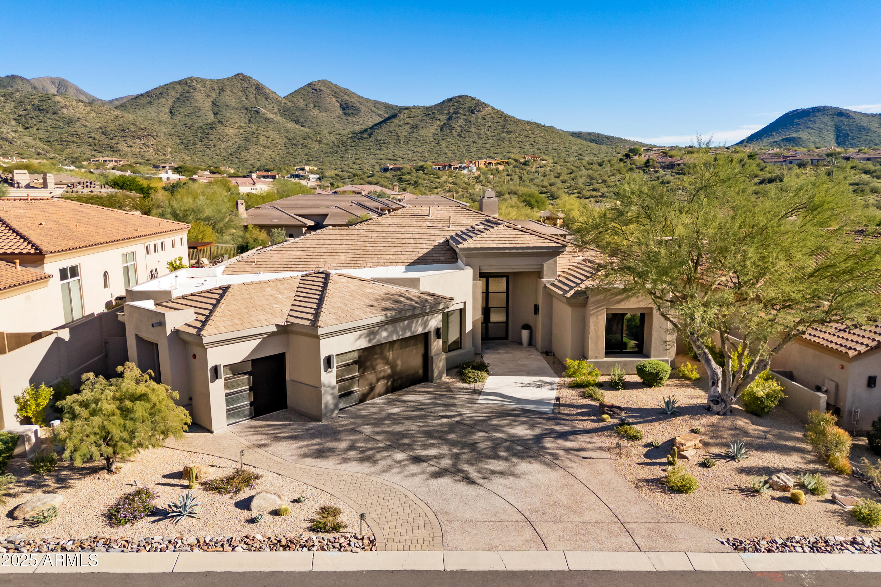 WOW...Spectacular Remodel with Striking Style & Luxury and Stunning Views. Upgraded in 2025 includes, all new Windows & Doors, AC Systems, Roofing, Cabinets, Appliances, Plumbing (Tankless Heater, Softener, R/O, fixtures, Tubs, Toilets, Sinks), 11'x 7' Front Door, Interior Doors & Hardware, Wood Floors, Fire Sprinkles, Lighting, Custom Garage Doors & Landscaping. Waterfall Island Kitchen with Miele 48'' Gas Range, Refrig. Columns, Wine Cooler & Quartz Counters open to an amazing Great Room features 12 Ft Ceilings, 74'' Gas Fp with 3D Stone, Chandeliers & Walls of Windows highlighting the astonishing Views. Spacious Master Retreat includes a 74'' Fp, Chandelier & Spa like Bath with Quartz Vanities, Tiled Floors & Walls, Tub & Sizable Custom Walk-in Closet. Impressive Resort Like Backyard with Outstanding Mt Views, Heated Pool/Spa, Gas Firepit, BBQ Island and back to natural wash! Landscaping Upgrades include all new underground water lines, valves, Lighting, BBQ Island, synthetic grass, pavers, plants, & gravel.