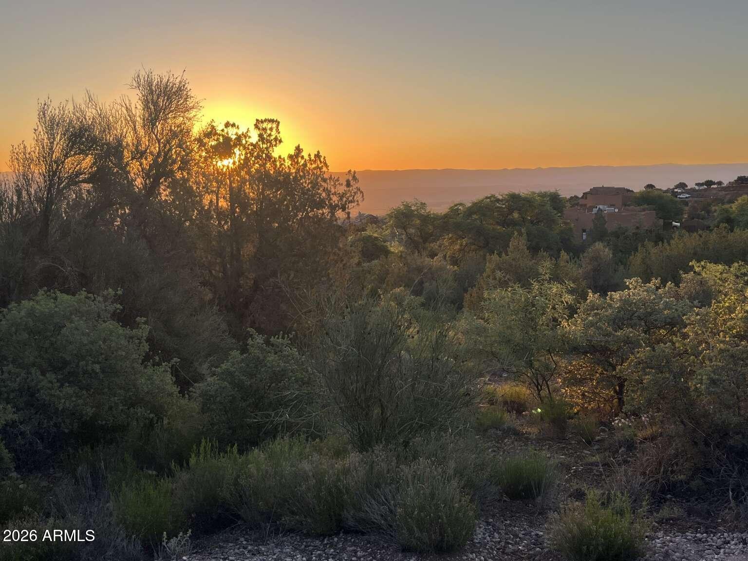 Privacy, freedom, views, and endless possibilities! This rare 2+ acre parcel offers a fantastic platform for your future dream home - nestled in one of Cottonwood's most prestigious and scenic locations. Imagine waking up to breathtaking panoramic views and designing a home that truly reflects your lifestyle. Located in the coveted Mingus Foothills South area, you'll appreciate the serenity, spaciousness, and pride of ownership in the surrounding custom estates. No HOA means flexibility and freedom to bring your own builder, vision, and dream to life. This parcel has underground electrical and communication on-site. There is a high pressure Artesian well drilled/capped on the property, one of only two in the entire Quail Creek Ranch subdivision. This gorgeous property is near the top of the top of the development with an altitude of approximately 4175 feet looking out towards the Sedona valley. With established homes on the parcels below, no view-blocking buildings exist.