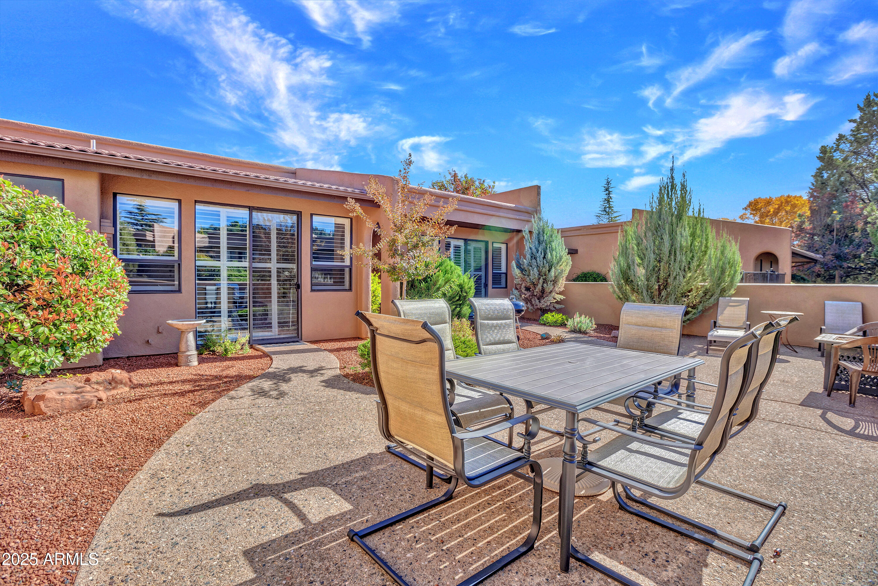 Lock the door. Walk to everything. Repeat.
Now priced at $699K and finally, it feels dialed in. Welcome to Arroyo Seco, where single-level living meets actual ease. No stairs. No dead space. Just under 1,600 sq ft of light, scale, &  a Thunder Mountain backdrop that never gets old. Clerestory windows and walls of glass blur the line between inside and out. The great room lives larger than expected. The Large patio? Built for sunsets, outdoor dining, and low-maintenance living. 
Two bedrooms, two baths, and just enough separation to host or unwind without friction.
Pool and spa two doors down. Trails, coffee, groceries...all walkable. This is Sedona without the complication. Clean. Simple. Done right. Lock-and-leave easy. Harder to forget than you think. Priced to Move. Designed to Stay!