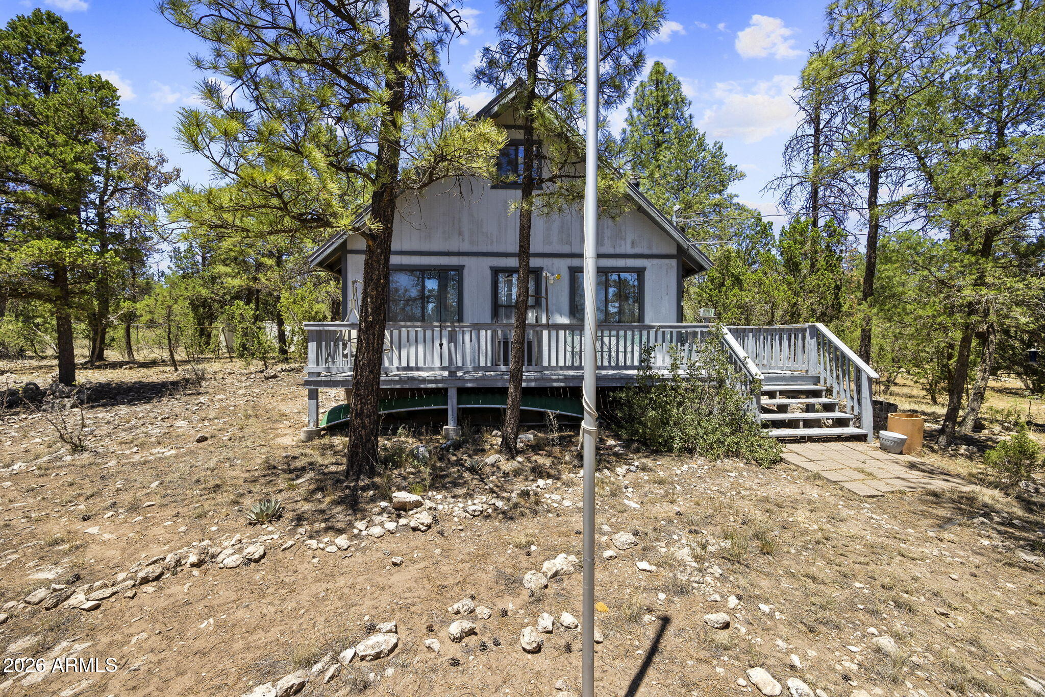 Escape to the mountains with this charming 2-bedroom, 1-bath home situated on 1.10 private acres. The inviting interior features vaulted ceilings that create an open, spacious feel, while the pellet stove provides cozy warmth on cool mountain evenings. A durable metal roof offers lasting peace of mind. Outside, you'll find plenty of room to enjoy the property, along with a powered storage shed that's perfect for a workshop, hobbies, or extra storage. Whether you're looking for a full-time residence, weekend getaway, or investment property, this mountain retreat offers comfort, space, and endless possibilities.