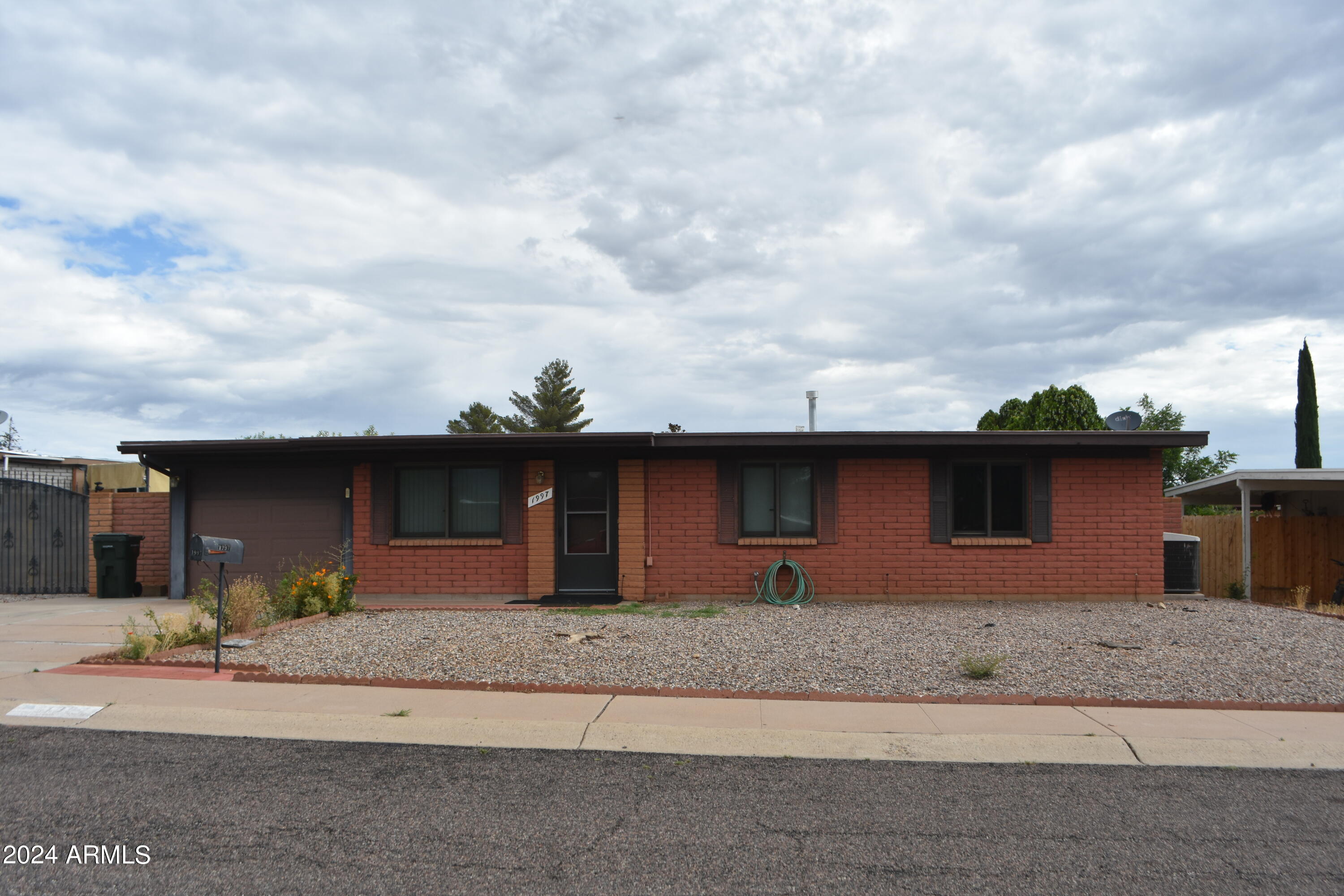 Great location close to shopping.  Nice three bedroom two bath with one car garage.  RV gate and parking. Custom Anderson windows, low maintenance for the spacious yard.  Includes washer and dryer.  Move in Ready.