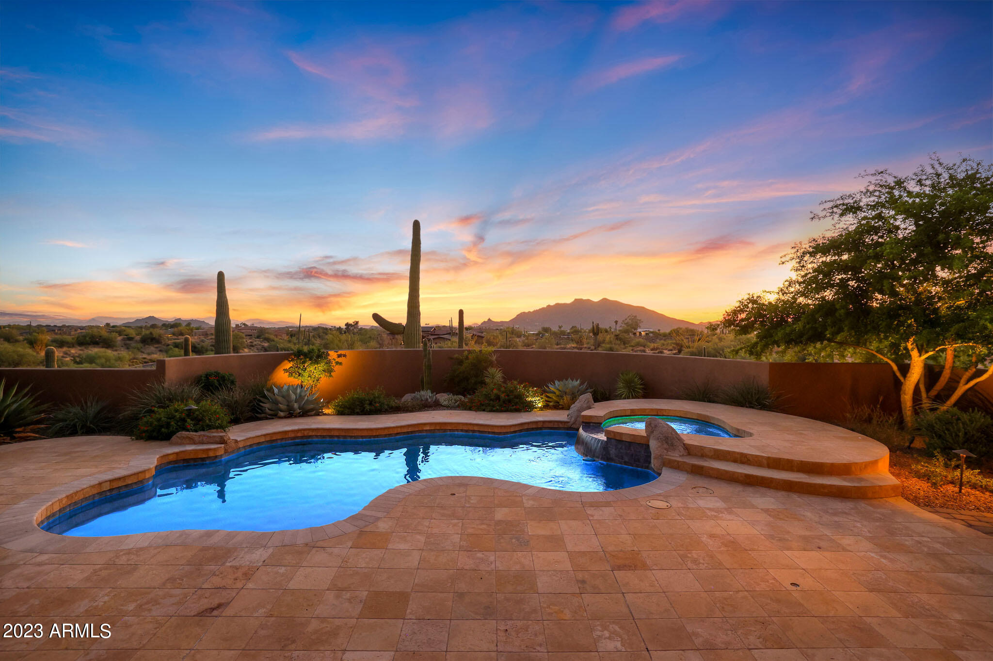 Privacy and unobstructed views abound from this home situated on a 1.2-acre lot tucked away in The Village at Gamble Quail at Desert Mountain.  Desert Mountain Golf Membership available.

Upon entering the home you will instantly be captivated by the artistry and craftsmanship that define this residence. The open floor plan offers a great room ideal for entertaining with 16 foot wood beamed ceiling, a beautiful stone-faced fireplace, a barrel ceiling in the dining room, and wet bar. The kitchen is a chef's dream, featuring custom wood cabinetry, an oversized island, and stainless steel appliances, including a wine fridge, a walk-in pantry, and breakfast nook. The primary bedroom is located off the great room and is the perfect retreat, with a corner stone-faced fireplace, wood-beamed ceiling, and a separate exit to the backyard. The primary bathroom includes his and hers vanities, a separate shower and tub, beautiful wood cabinetry, a private water closet and access to a flexspace that can be used as a gym area or office. Additional rooms include an office off the great room, a grand guest bedroom that has its own ensuite bathroom, and an attached casita space with a sitting area, bedroom, bathroom, and private balcony for your guest's ultimate comfort and privacy.

Step outside to discover a backyard with breathtaking views from Pinnacle Peak to Black Mountain. You'll find a spacious covered patio with a cozy fireplace ideal for entertaining, a refreshing pool with an elevated spa and a built-in barbecue. With its exceptional views and well-designed outdoor living spaces, it's the perfect place to soak in the sunsets and enjoy the serene desert landscape.

Experience the Desert Mountain community, with seven golf courses, 10 restaurants, HealthSpa/ Fitness center, pickleball, tennis, bocce and croquet courts, 20+ miles of private hiking trails, and a myriad of year-round planned activities. Club membership application/approval process is 30 days. Please see membership information under the document tab.