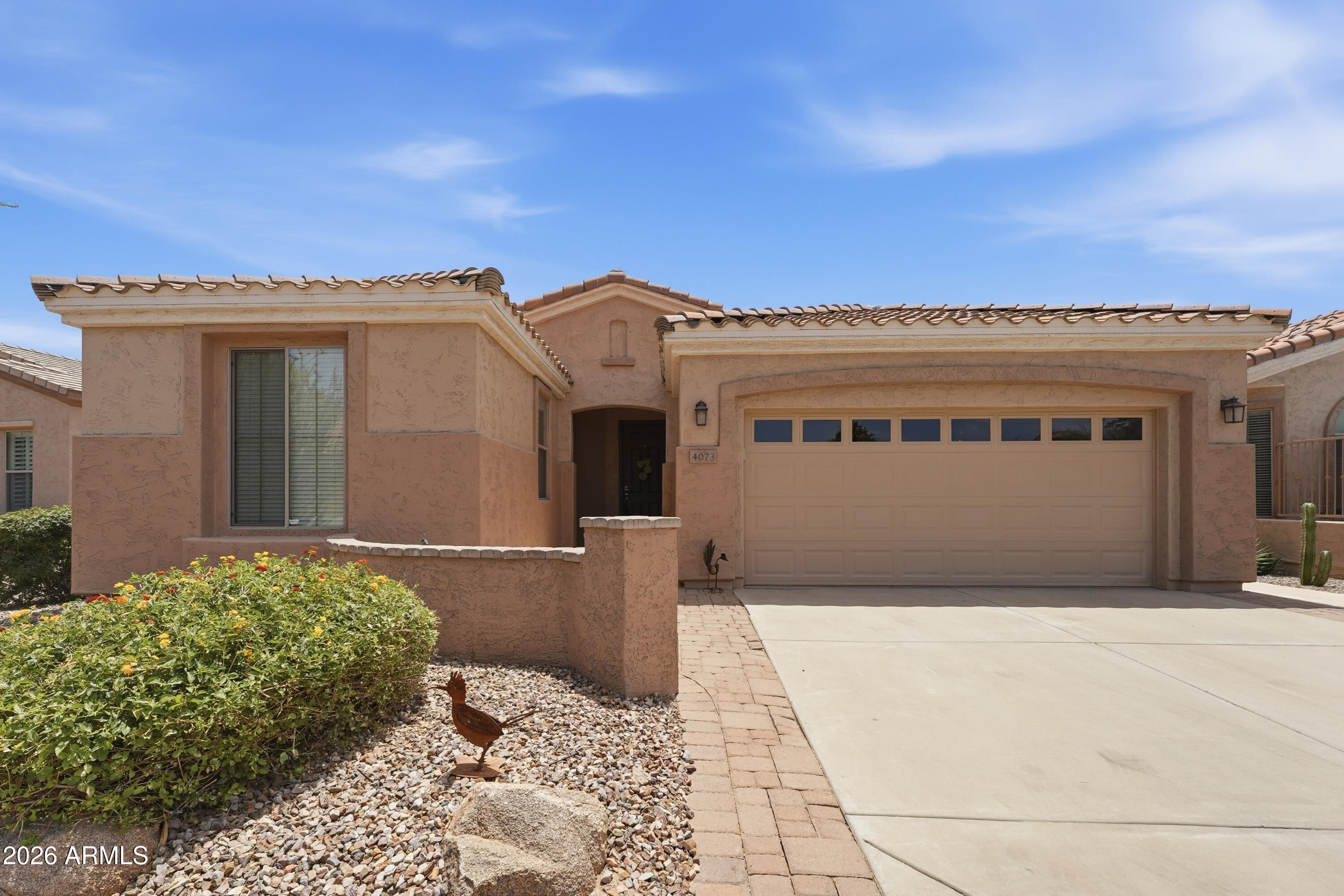 AN ABSOLUTE GEM! ONE OF TRILOGY'S MOST POPULAR OPEN FLOORPLANS. THIS HOME HAS BEEN METICULOUSLY MAINTAINED WITH ALL THE RIGHT UPDATESIN PLACE. FEATURES 2 BEDROOMS PLUS A DEN, VERY OPEN KITCHEN WITH TONS OF COUNTER SPACE. SOFT NEUTRAL COLORS SOOTHE THE SOUL AND GLADDEN THE HEART. SPLIT PLAN OFFERS PERFECT SET-UP FOR GUESTS. PLENTY OF SIZE IN THE MASTER WITH UPDATED MASTER BATH AREA AND TILED WALK IN SHOWER. NICE TILE & CARPET FLOORING, SHUTTERS, CROWN MOLDING, CEILING FANS, LAUNDRY SINK, SPEAKERS, WATER SOFTENER & GARAGE CABINETS JUST START THE EXTENSIVE UPGRADE LIST. THE BACKYARD IS A TRANQUIL PARADISE WITH VIEWS & SOUNDS OF WATERFALL, PUTTING GREEN COVERED PATIO & EXTENDED PAVERS. ALL THIS IN ONE OF THE BEST 55+ COMMUNITIES AROUND. DON'T MISS THIS WONDERFUL PROPERTY.