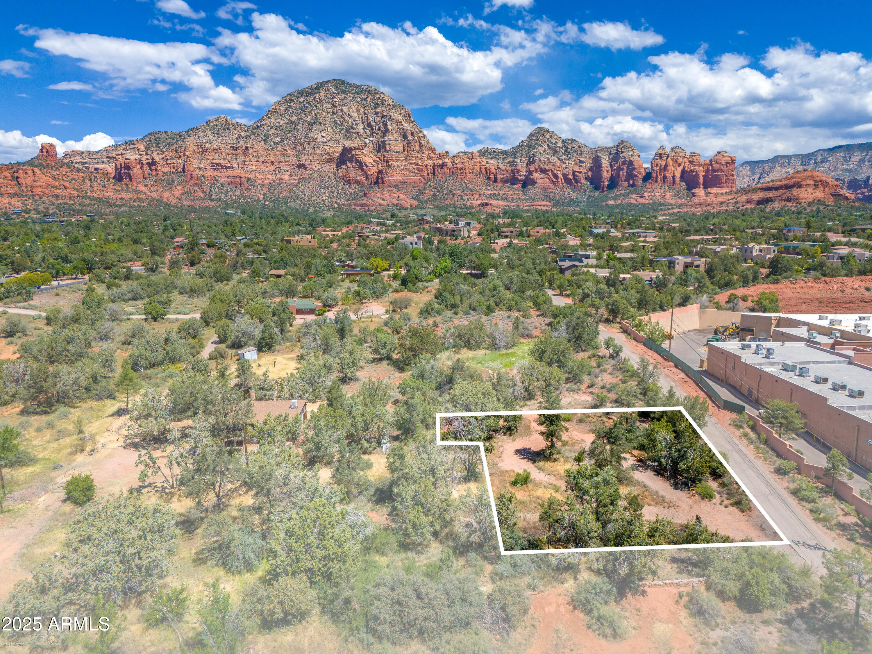 One of 2 buildable contiguous lots zoned for residential or manufactured homes.  This allows for development geared towards workforce housing, tiny home project or a long term investment. Rolling land with natural building site and utilities available including sewer. No HOA or CC&R's to hamper your ideas or business plans for this valuable parcel right in the middle of West Sedona - walking distance to restaurants, shops, grocery stores and National Forest trails.