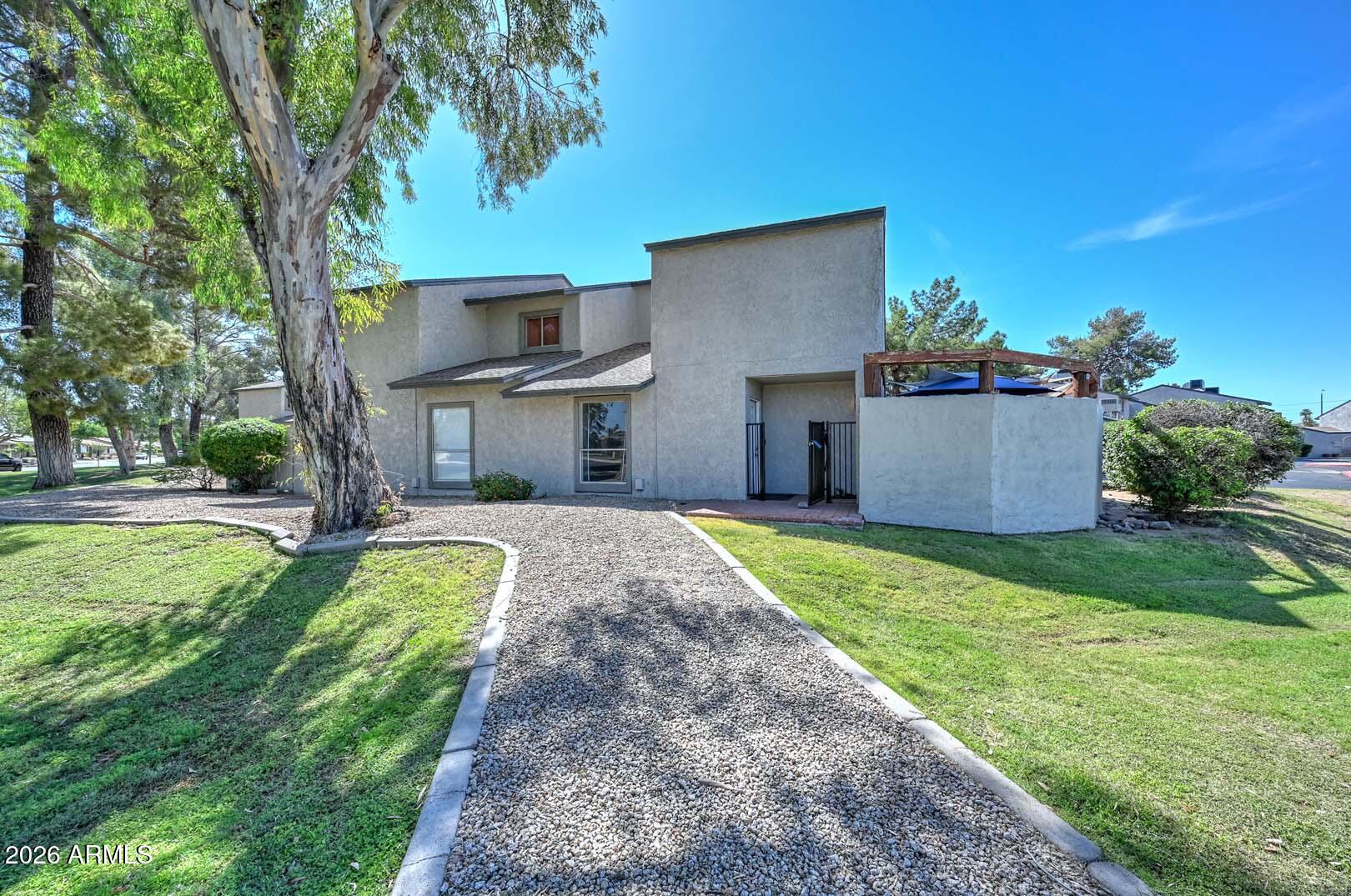 This beautiful 3 bed/2bath, 1,369 sq ft townhouse is located in the Quail Hill Subdivision. The entire unit recently received a fresh coat of paint.  The new A/C unit was installed on 4/2025 and a new water heater installed 4/2023.  The kitchen includes newer stainless steel appliances, breakfast bar, pendant lighting and plenty of cabinet space. Step outside through the French doors to the eye-catching patio with a paved floor and shade sails above. A perfect area for relaxing or entertaining. Upstairs you will find all 3 bedrooms. The primary has a walk-in closet and private bathroom. The other side of the upstairs hall features 2 large guest bedrooms and a full bathroom. This is an end unit tucked at the back end of the subdivision with plenty of green belt space right outside the door.