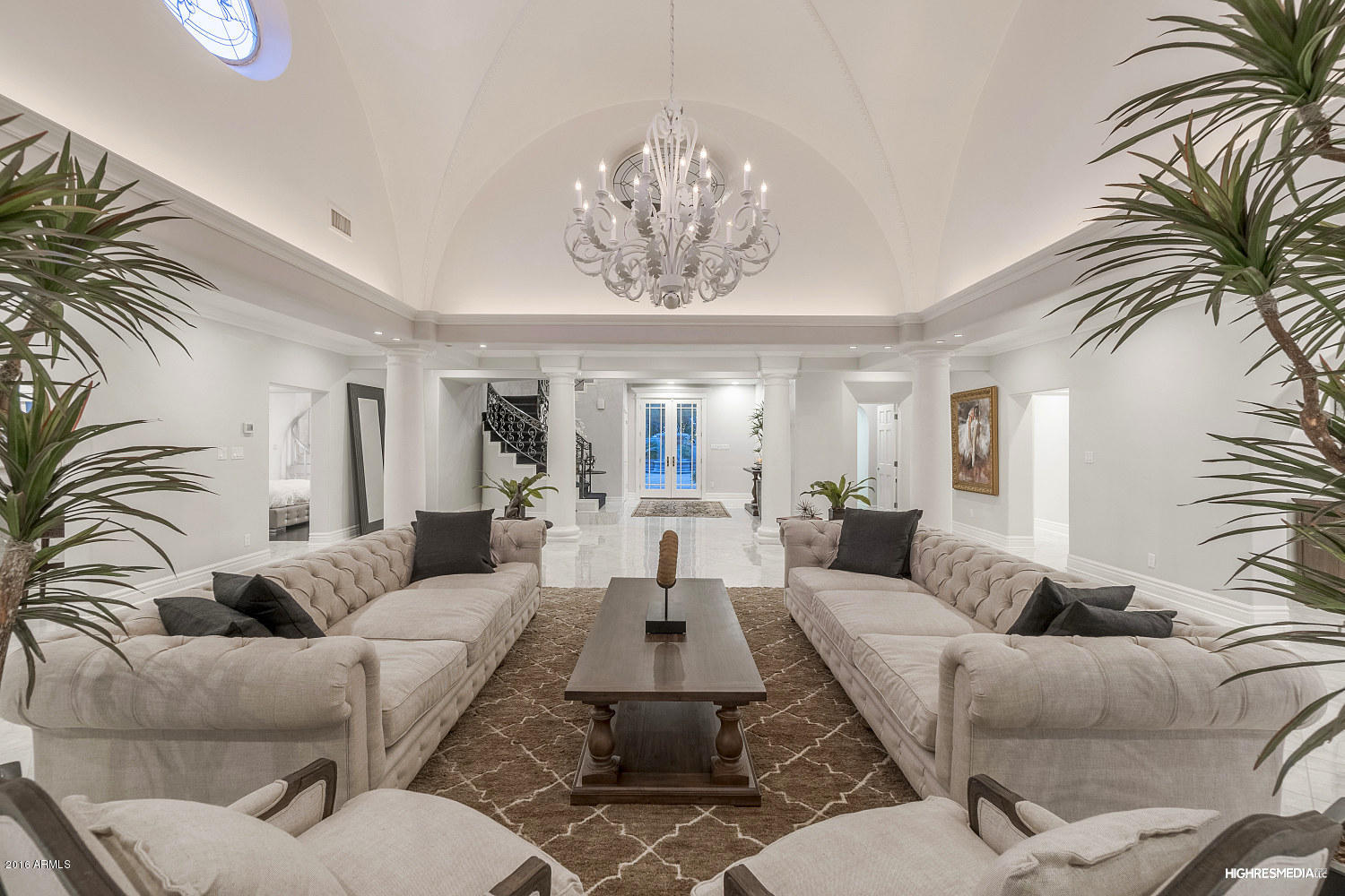 Completely renovated in 2015 and sited on a uniquely large double lot, this regal Mediterranean style home is one of Arcadia's most impressive offerings. Effortless flow of this ideal floor plan is designed using sophisticated craftsmanship and the most current design palette. Features of note include new electrical, plumbing, and flooring, a grand scale staircase, new Gaggenau, Subzero, and Decor appliances, flex space/nursery, and plenty of open entertaining areas. The exterior blusters with a lighted tennis court, new mature landscaping, new LED indoor/outdoor lighting, a mosaic tile pool and several spaces for entertaining al fresco. Minutes away from the trendy Scottsdale and Biltmore Fashion Square shopping centers make this location ideal. Simply unrivaled in its scope, luxury and privacy, this extraordinary fully remodeled estate offers the best of Arcadia luxury living in a truly sublime setting.