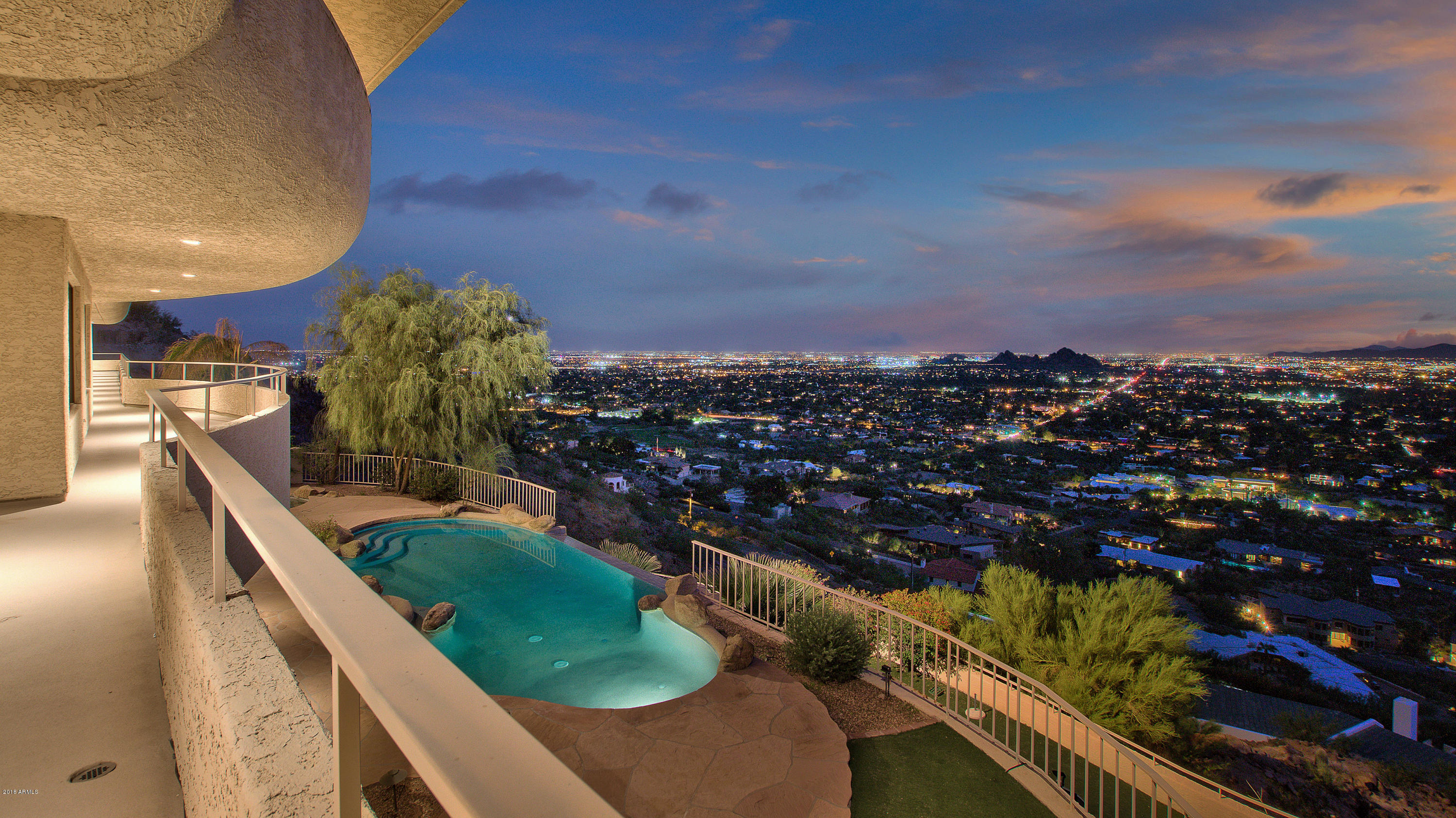 Certain homes just take your breath away. This one has it all. Right at the top of Camelback mountain the views are the very best in all of the Valley. Timeless contemporary architecture. The master suite has a upper level observatory room/meditation room surrounded by stunning views from every direction. Entertaining space featuring game room, restaurant style sunken bar & movie screening area. Office and conference room. 6 car garage. Professional standard Gym with locker room. Lighted Sports Court. Heated Pool & Spa. 2 separate guest casitas. Gated enclave of one of a kind view properties on the south slope of the Camelback mountain, and also privately gated motor court. These Camelback mountain estates rarely come on to the market!