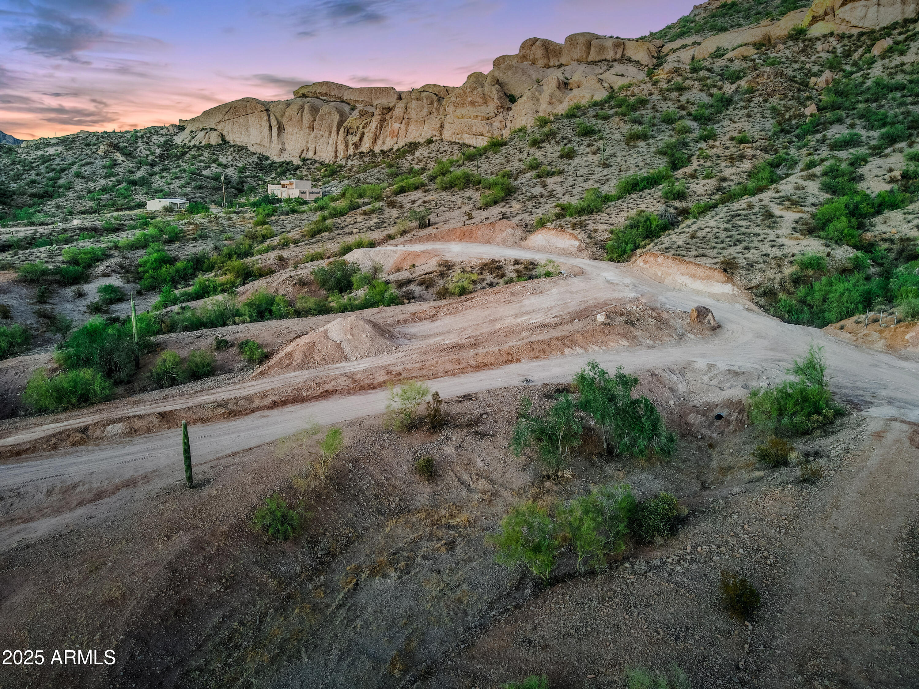 RARE FIND! 1.25 ACRE PARCEL with ONE-OF-A-KIND Mountain Views and Mountain backdrop! Property borders STATE LAND and is VERY PRIVATE. Elevated Parcel with views of the Goldfield Mountains, Bulldog Canyon, Saddle Rock Mountain, and City Lights. NO HOA. Property HAS ACCESS TO WATER - SHARED WELL. Property Owner installed multiple culverts for drainage. House Pad is visible. Perfect for those who love the outdoors - you are +/- 1/2 mile away from Tonto National Forest. Enjoy hiking, horseback trails, and more. Easy drive to Canyon Lake and only 45 min to Sky Harbor Airport. BOUNDARY SURVEY AVAILABLE. Ready for you to build your Arizona dream home!