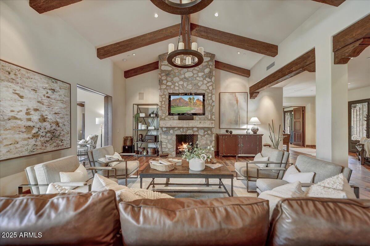 This refined CSE Silverleaf Casita is sensible sophistication at its finest. The Casitas are modeled after the Silverleaf clubhouse, eminent in style and design for the most discerning homeowner close to the clubhouse. Single story relaxed ranch uses a mix of materials and influences bringing a fresh twist to Southwest style. An entertaining dream with open great room floor plan, Fabulous indoor-outdoor living with telescoping glass doors to the outdoor living spaces and backing to an open wash, desirable southwest exposure featuring an alfresco outdoor room with fireplace, pool with water feature and spa, lounge area, eat in outdoor kitchen, firepit with sitting area. Bringing nature indoors with reclaimed oak flooring and indigenous stone throughout... used to clad fireplaces both indoors and out, hand-hewn wood beams, knotty alder cabinetry, and copper sinks and faucets all add to the home's distinctive character. Eat in kitchen island boasting Viking and SubZero appliances, with stylish copper vent, with an appropriate back kitchen with wine fridge, coffee maker, microwave and refrigerator. Abounding with exclusive finishes including hand-woven Spanish cotton upholstered bath accent walls finished with large Clavos, copper vanity and bucket sink, rawhide shades top chic iron scones, herringbone and brick lay tile flooring in baths, exquisite quartz and travertine slab countertops. Pristine two car garage and Lutron lighting system. Located in the coveted 32 home cove, conveniently located just off the drive to the Silverleaf clubhouse.