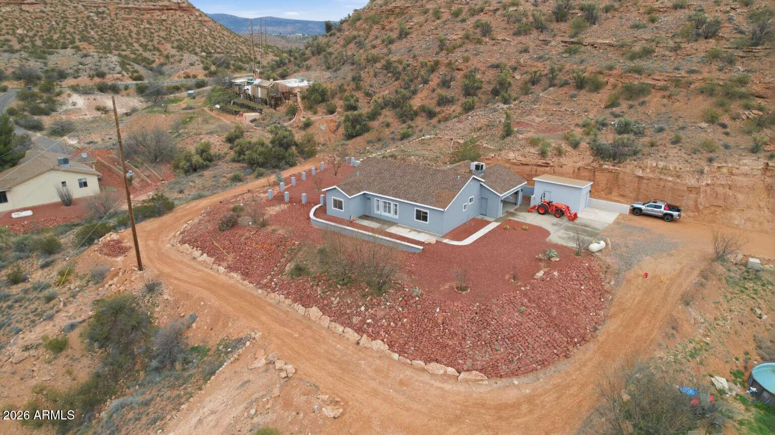 [INSTANT EQUITY] - Recently Updated Hillside Retreat Below Appraisal! Experience the perfect blend of modern comfort and Arizona beauty in this recently updated 3-bedroom, 2-bathroom home. Perched on 2.67 elevated acres with sweeping 360-degree panoramic views, the property has been refreshed to offer a crisp, move-in-ready lifestyle. Strategically priced below its recent appraised value, this is a rare instant-equity opportunity in the sought-after Sexton Ranch area. The open-concept 1,414 sq. ft. floor plan flows seamlessly, enhanced by a modern whole-home refresh. Notable updates include durable LifeProof™ plank flooring throughout living areas and new porcelain tile in bathrooms. Enjoy a bright, airy atmosphere courtesy of a fresh, neutral color palette (Warm Grays & Crisp Whites) that provides a perfect canvas for your personal style. The kitchen features new Corian countertops, new dishwasher, disposal and updated modern fixtures for a seamless look and easy maintenance. [Outdoor & Lifestyle:] Spreading over 2.6+ acres of private hillside with NO HOA offering plenty of room for toy parking, workshop space, or outdoor projects. Enjoy multiple outdoor living spaces perfect for sunsets, while native landscaping ensures the home is beautiful and easy to maintain. [Location:] Enjoy the peace of rural living close to Oak Creek and wilderness trails with the amenities of Page Springs Wine Country nearby. Enjoy easy access to the cultural hubs of Sedona and the conveniences of Cottonwood.
