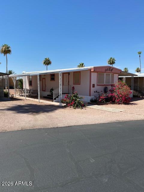 This 1 bed 1 bath home is located in the Ironwood MHP 55+ park. The flooring has recently been replaced with laminate flooring throughout the house. The house has easy access to the clubhouse and pool area, being just steps away. Nice sized shop/storage area  adjacent to the carport. Easy access to shopping and recreation areas. The Salt River, Saguaro lake and Canyon lake are all within a 20-30 minute drive. Hiking trails can be found about 5 minutes away within the nearby Tonto National Forest. Easy access to both U.S. 60 and AZ Loop 202.