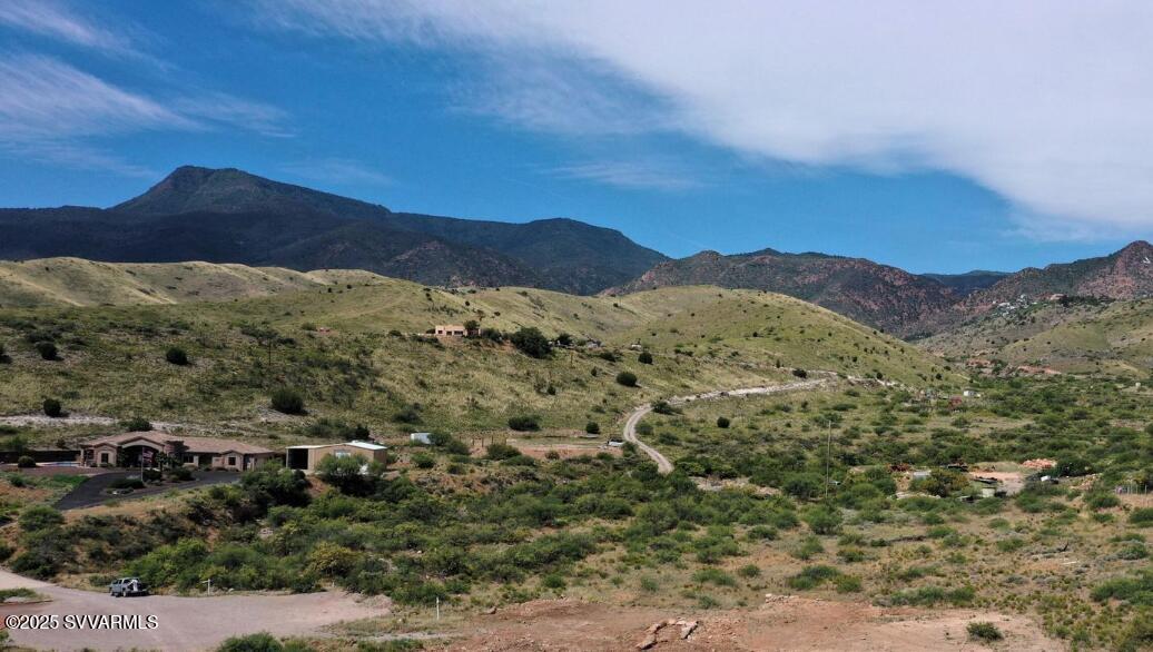 Custome home site on this 2 acre property with amazing views!!   Located just outside the towns  of Jerome and Clarkdale right off historic Highway 89A. Offering beauty and serenity of quiet living along with expansive views of the majestic Sedona Red Rocks! To the west are views of the beautiful Mingus mountain range and historic mining town of Jerome. Property is already serviced by a shared well and a 4 bedroom septic system.
Underground conduit ran to the property line. This property offers endless potential! 1800 SF Site built 2 car garage minimum CC&R's keep the integrity of
this beautiful neighborhood. Owner will carry!!!