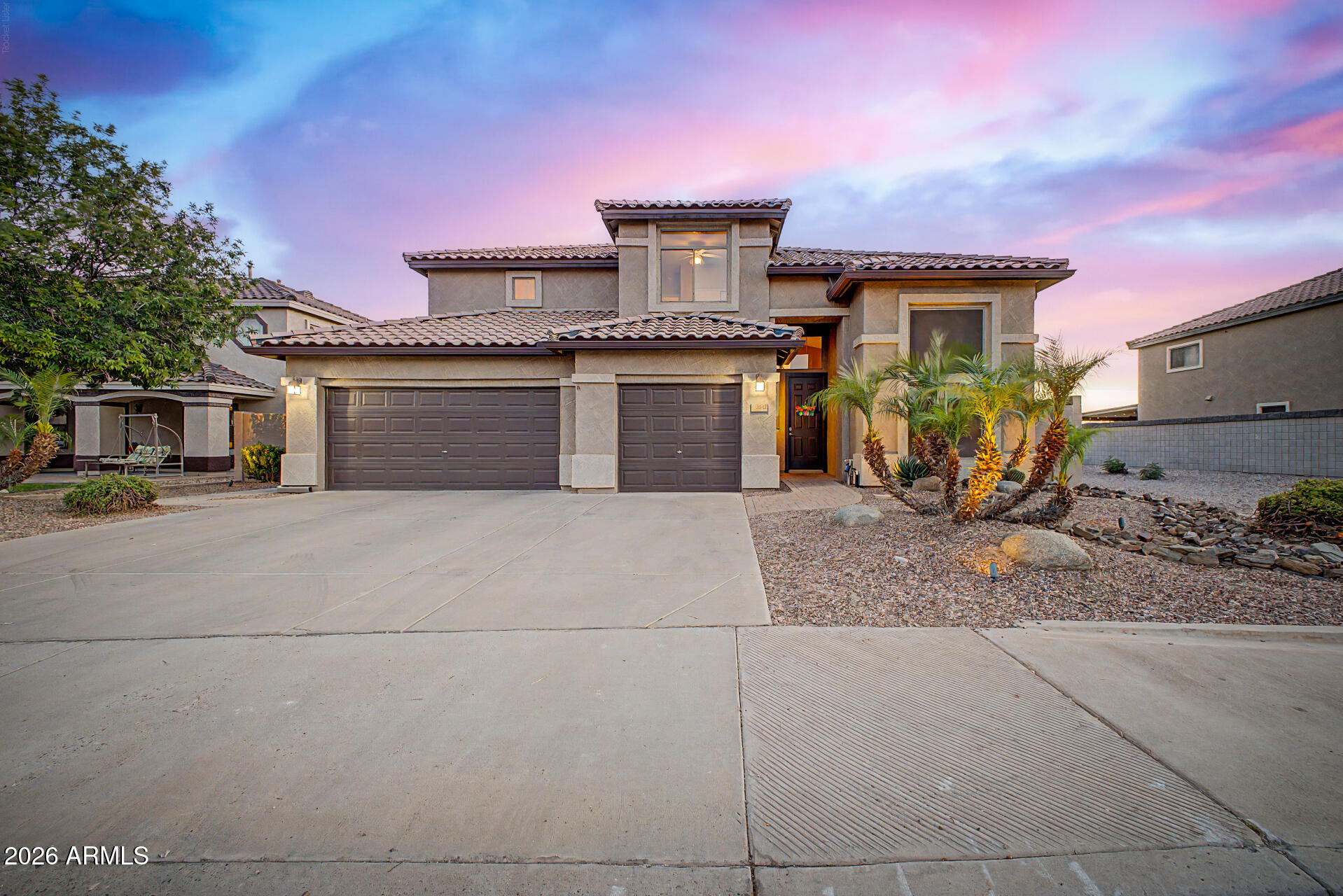 Stunning 4-bedroom, 3 full bathroom home with sparkling pool, spa, 3-car extended garage, and beautiful views! Thoughtfully designed floor plan features 1 bedroom and a full bathroom downstairs--perfect for guests or multi-generational living. Bright eat-in kitchen offers granite countertops, ample cabinetry, and seamless flow into the main living spaces, ideal for entertaining. New roof in 2020, carpet in 2025, pool-spa cool decking and in-floor cleaning system 2026. Spacious primary suite with two walk-in closets, generously sized secondary bedrooms, bathroom and another walk-in closet provide comfort and flexibility. Step outside to your lush backyard retreat with pool, spa, and putting green, backing directly to the greenbelt! No neighbors behind for added privacy and room to relax while taking in the views. A perfect blend of space, style, and Arizona outdoor living! Also, many of the windows were recently upgraded. Exterior paint was done in 2023 and gutters were added.