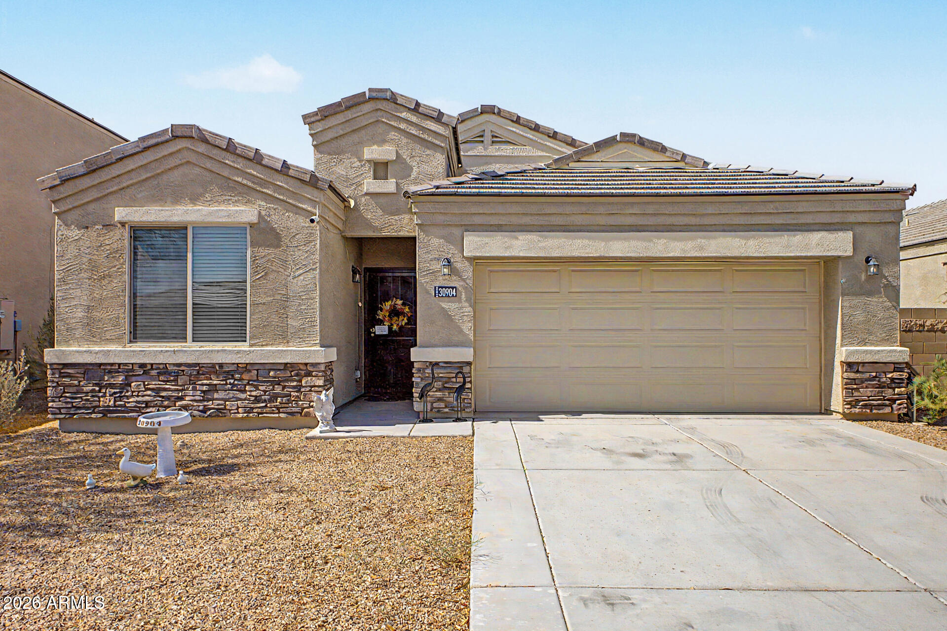 Well-maintained 4-bedroom, 2-bath home located in the Tartesso community of Buckeye. Built in 2019, this property offers a functional open floor plan with a spacious great room that flows into the kitchen and dining area.

The kitchen features granite countertops, a center island with breakfast bar, gas range, and ample cabinetry. Additional interior features include ceiling fans, updated fixtures, and a security door. The home is equipped with a OWNED solar system, providing added energy efficiency.

Community amenities include parks, walking trails, splash pads, sports courts, and a neighborhood school, all set against scenic desert and mountain views.

Professional photos coming soon.