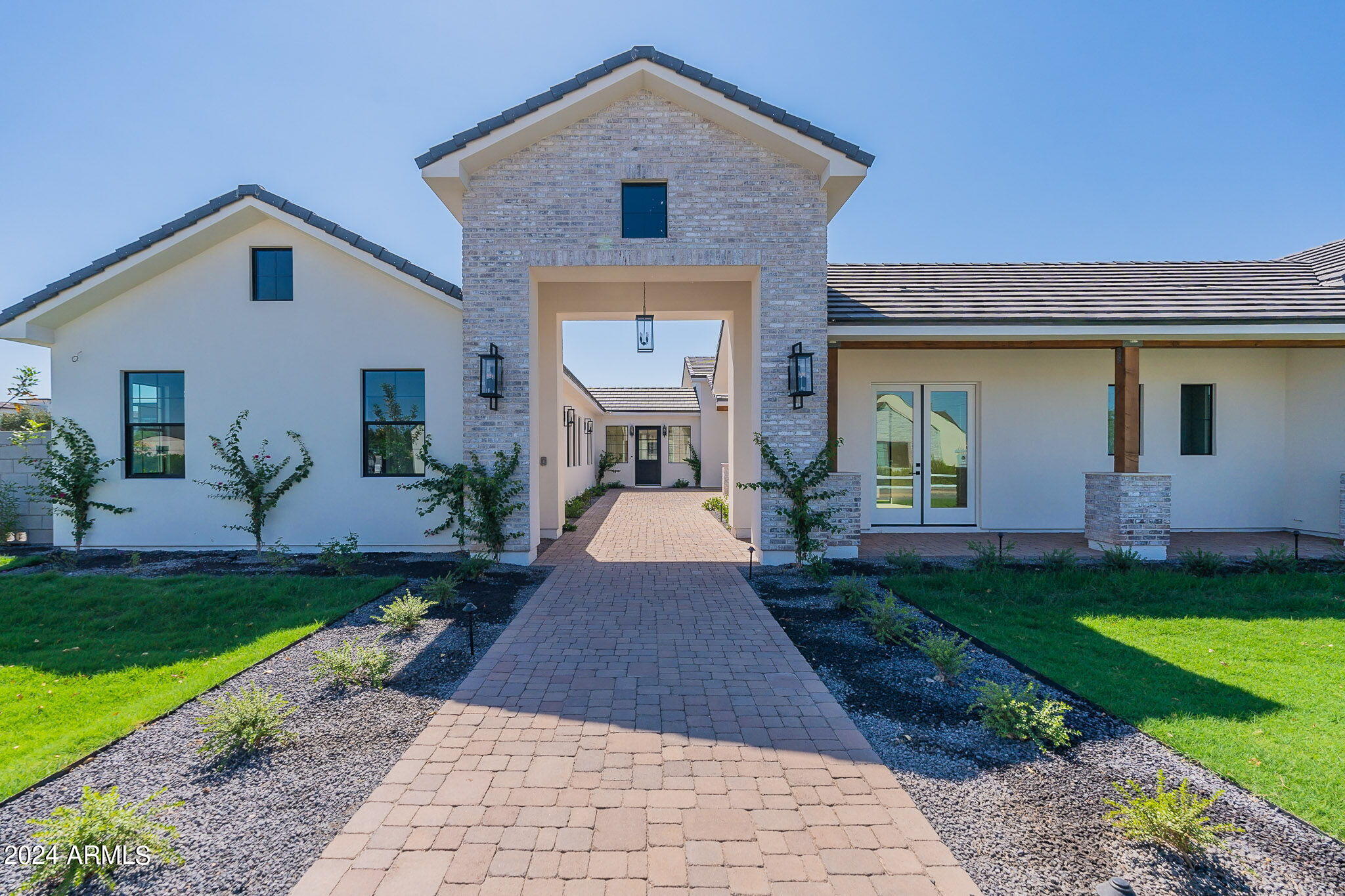 Luxurious newly built & professionally designed masterpiece! This stunning home offers 5 generously sized bedrooms & 7 exquisite bathrooms, including a unique bedroom w/ a private outside entrance, perfect for guests/extended family. The state-of-the-art kitchen is a culinary dream, featuring top-of-the-line Wolf & Sub-Zero appliances, complemented by elegant finishes & ample counter space. A dedicated teen room adds versatility, while foam insulation ensures exceptional energy efficiency. Step outside to your own private oasis, complete w/ two sophisticated firepits, a sprawling pool & a rejuvenating spa. The meticulously landscaped front & back yards create a seamless blend of beauty & functionality. Located near major roads & highways, this home offers easy access to key amenities. Enjoy proximity to vibrant downtown Gilbert, renowned for its dining, shopping & entertainment options. Additionally, nearby facilities include top-rated schools, scenic parks & recreational areas. This residence combines opulence w/ convenience, making it the ultimate retreat for both entertaining & relaxing.