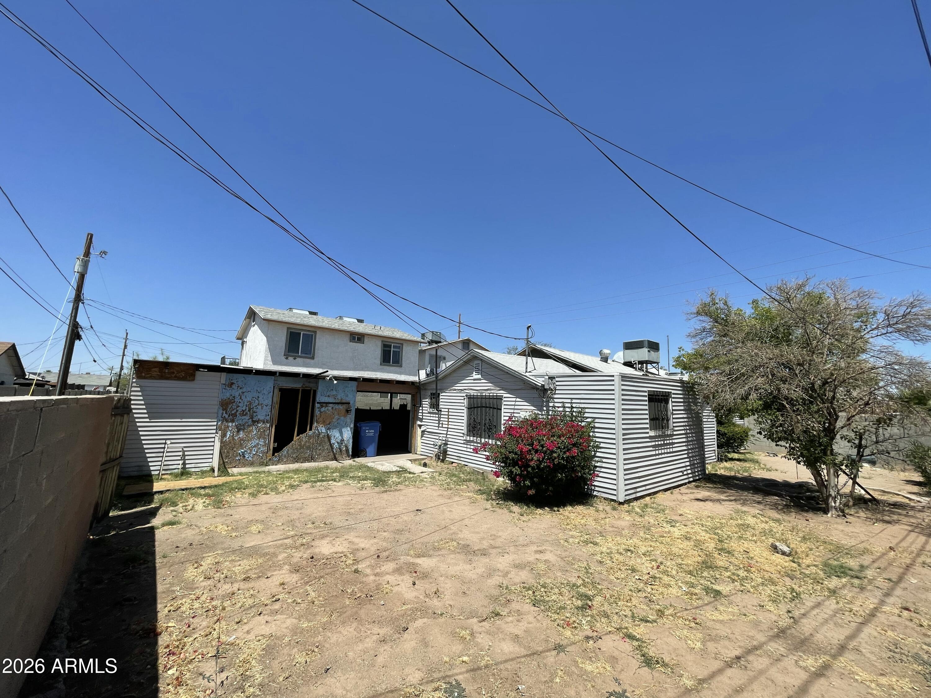 Investor & Developer Goldmine in the Heart of Phoenix! The true value of this property lies in its exceptional land utility and premium location. Sitting on a 7,253 sq ft lot with R-4 Multi-Family zoning, this site is legally capable of hosting up to 4 units. 

The current sellers have already met with the City of Phoenix and laid the groundwork for a premium concept plan: building two brand-new townhomes while converting the existing structure into a third, creating a high-yield 3-unit compound. Concept plans and preliminary designs are ready for review. The sellers are actively working on finalizing these entitlements; buy now at $269,000 in As-Is condition before the price increases once entitlements are fully secured. 

Highly attractive for investors looking to deploy c capital gains, this property is situated within a Qualified Opportunity Zone (QOZ), with adjacent parcels along Portland Street sharing the same active status.

Alternatively, choose to rehab and flip the existing structure in this rapidly up-and-coming neighborhood. The current detached character home features 2 bedrooms, 2 bathrooms, and 1,264 sq ft of potential. Unparalleled urban convenience--just minutes from the Loop 202 and I-10 freeways, downtown dining, nightlife, and schools. Opportunity knocks loud here--bring your vision and capture the upside!