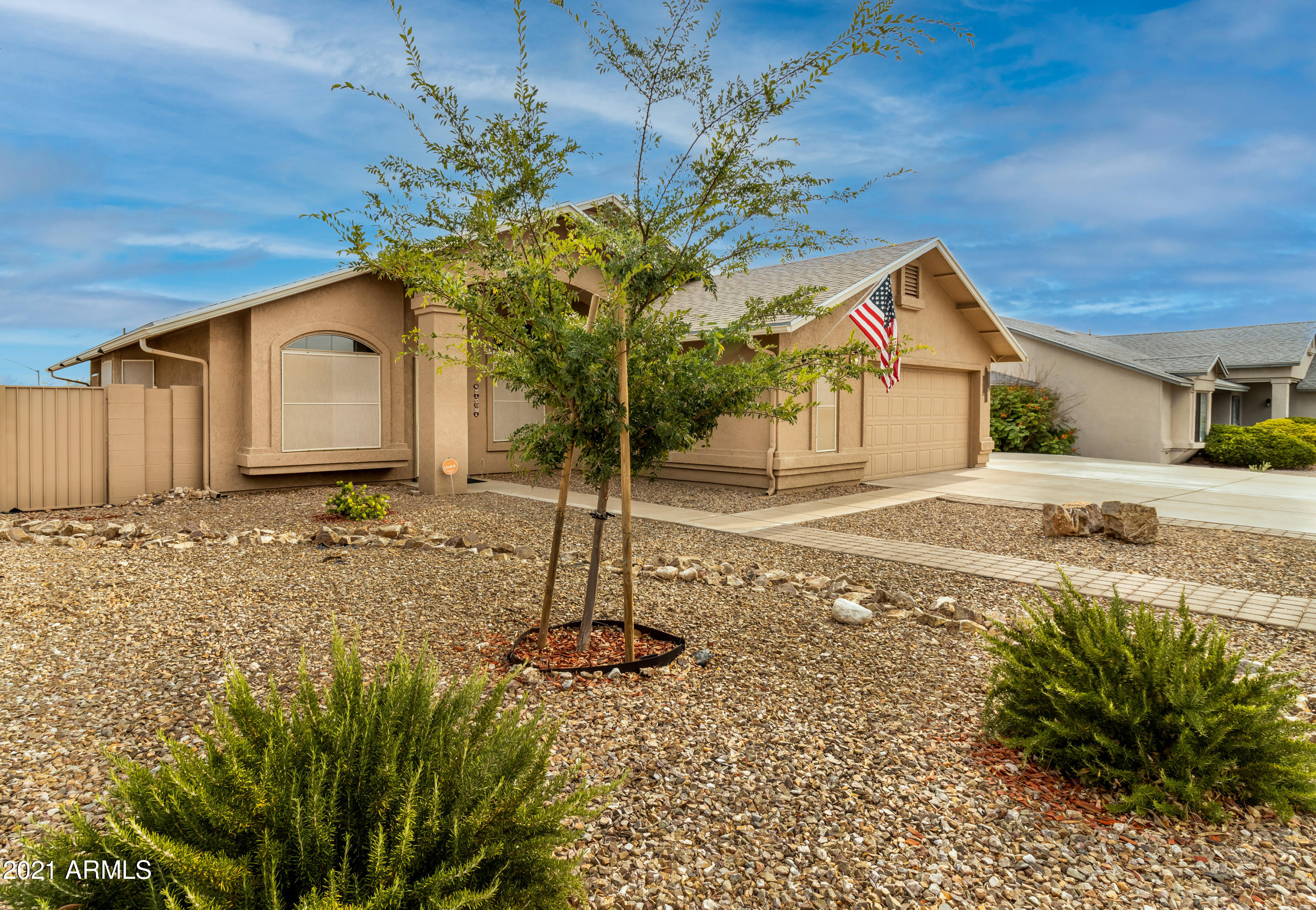 Beautifully maintained 4 bedroom, 2 bath home with lots of upgrades! This Shadow Ridge home features a separate living room & family room. Open kitchen with breakfast nook & granite counters. The master bedroom has a bay window, walk-in closet & spa-like bathroom featuring dual sinks, garden tub & walk-in shower with beautiful tile work. The backyard is great for entertaining. You'll love the low maintenance yard with artificial grass, flagstone surround fire pit & extended patio. Some of the extras include a larger driveway with room to park an RV, extra garage space with utility sink, wood stove in the great room, tiles floors throughout with carpet in the bedrooms, window seats, plant shelving & more. New AC & furnace was installed in 2020 along with new water heater.