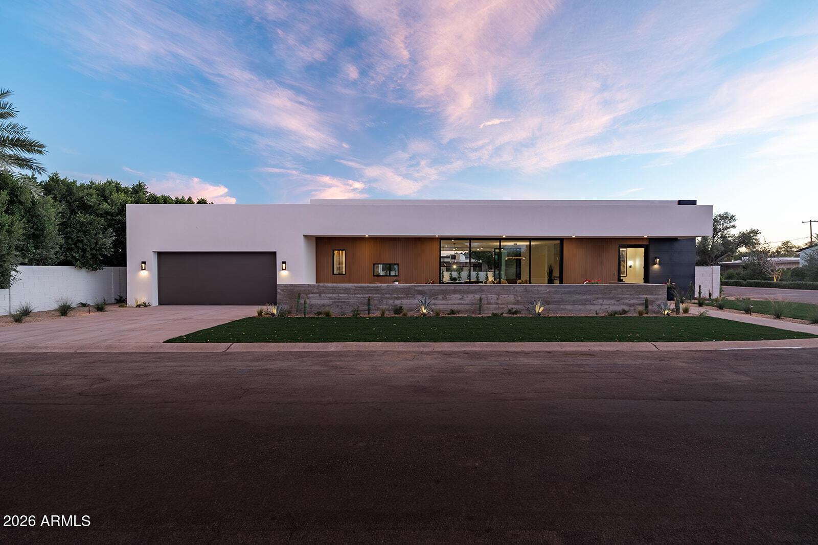 Brand-new from A/M Living, this modern Paradise Valley residence is just a short walk to some of Scottsdale's best restaurants. Offering 3,429 SF, the home features 4 bedrooms, 3.5 baths, a bonus room, and an oversized 3-car garage. Designed for effortless Arizona indoor/outdoor living, it showcases expansive sliding glass doors, a desirable split floor plan, and high-end finishes with organic stone and warm wood textures throughout. The spa-inspired primary suite is a private retreat, while the resort-style backyard is perfect for entertaining and year-round enjoyment.