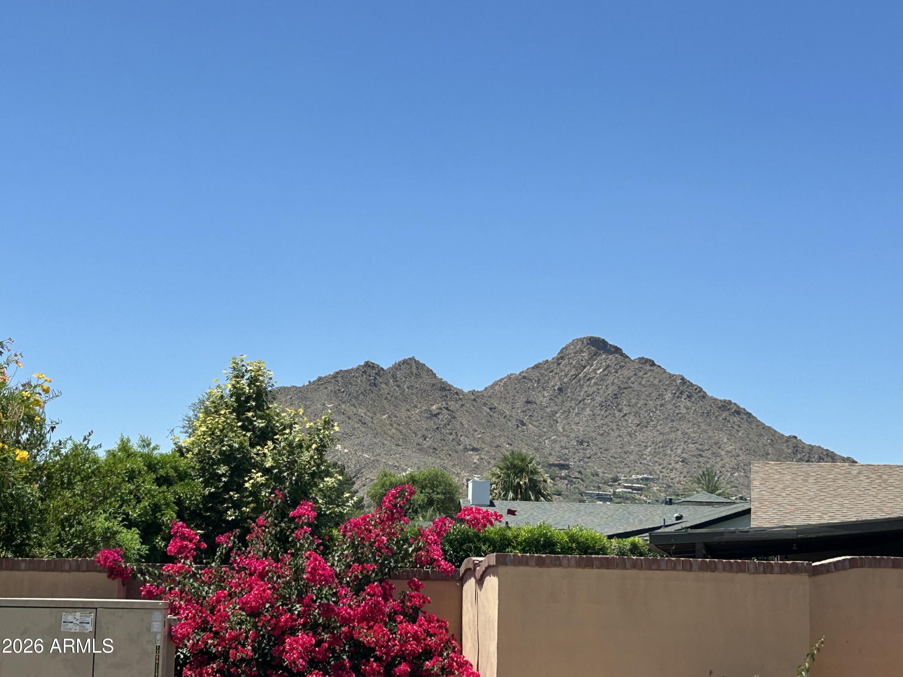 BEST flat new build lot in Paradise Valley under 2M! Prime location with unobstructed Camelback Mountain views. Walking distance to Fashion Square and Old Town Scottsdale. Property is currently on septic. Sold AS-IS. No HOA. PV Zoning R-18A. 25% Lot Coverage. No two stories going up, but BASEMENTS are allowed. Several luxury new builds and remodels in the area. HOT LOCATION. Buyer to verify all facts and material items.
