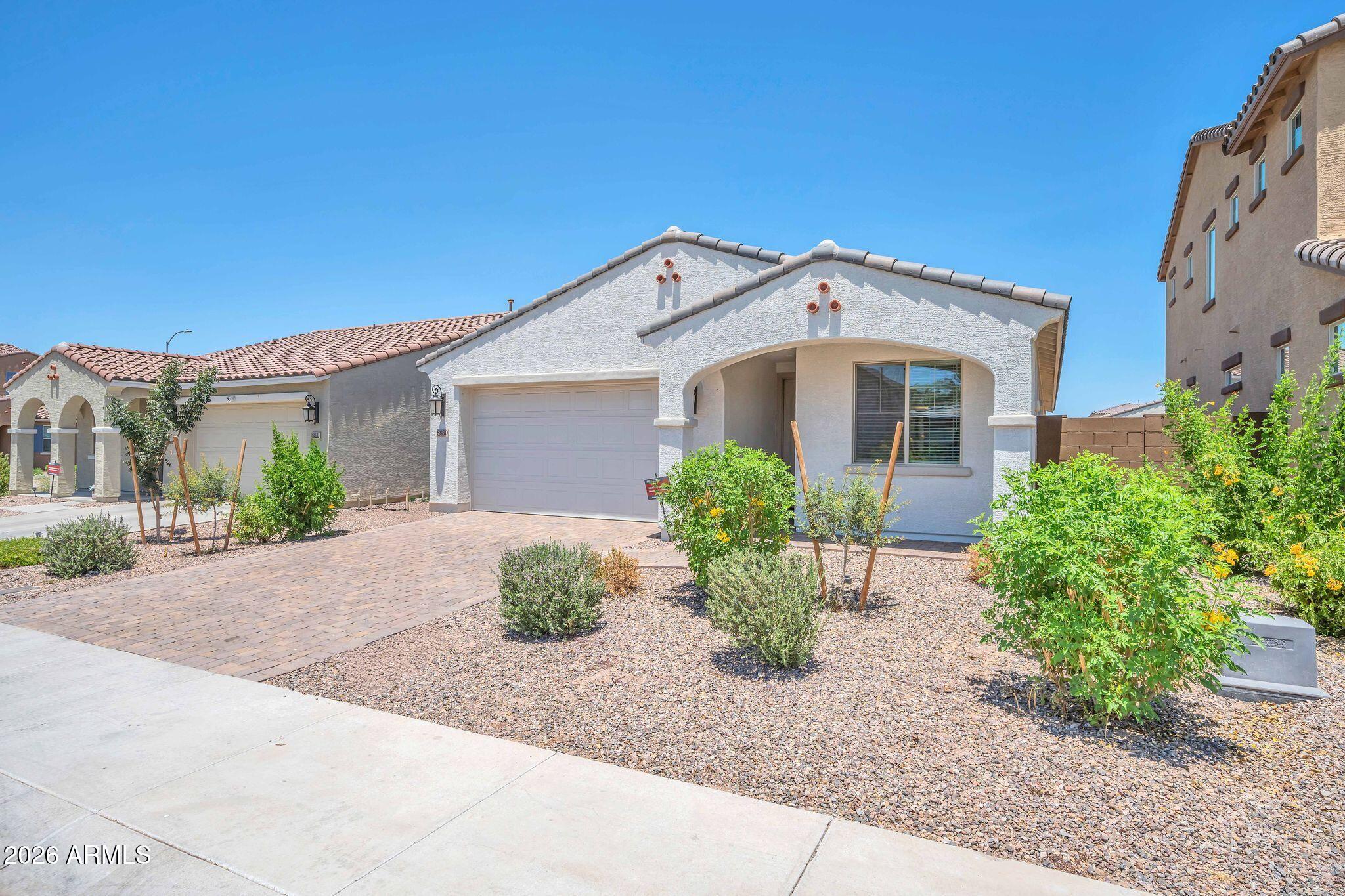 Beautiful and move-in ready 5-bedroom, 3-bath home in one of Glendale's most convenient locations near shopping, dining, entertainment, and easy freeway access. This spacious home features an oversized garage, paver driveway, walkway, and front porch, plus modern smart home technology, including Wi-Fi thermostat, video doorbell, and Wi-Fi garage door opener. The open-concept floor plan offers 9-foot ceilings, stainless steel appliances, abundant natural light, and comfortable living spaces designed for everyday living and entertaining. Built with energy efficiency in mind, the home includes Low-E dual-pane windows, high-efficiency HVAC, enhanced insulation, an EV outlet in the garage, and low-maintenance landscaping with irrigation. Conveniently located minutes from Westgate Entertainment District, State Farm Stadium, Desert Diamond Arena, parks, restaurants, and Loop 101