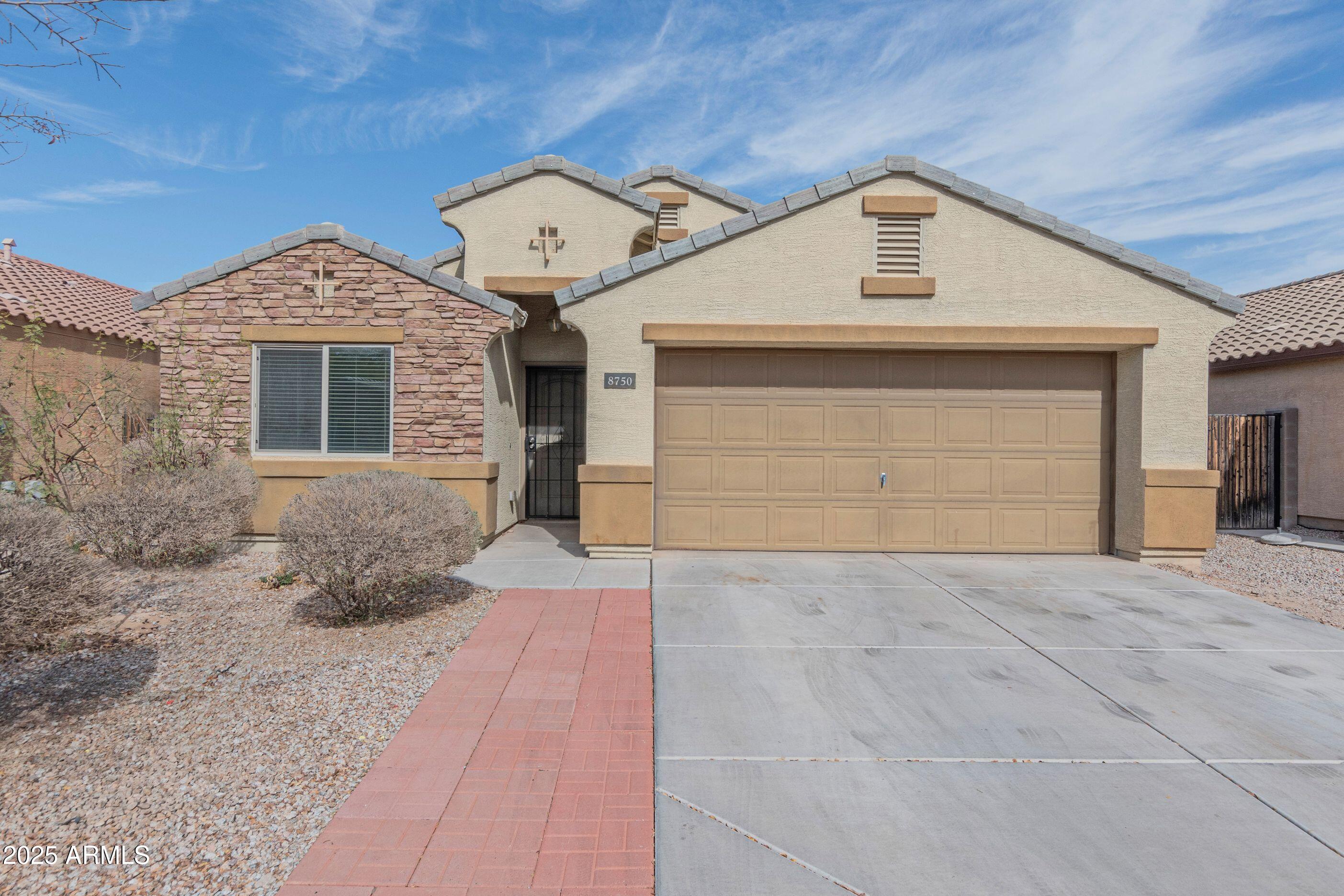 Welcome Home to Hurley Ranch! Your search ends here! This beautifully maintained 4-bedroom, 2-bath residence combines thoughtful design, generous living spaces, and an unbeatable location in one of Tolleson's most desirable neighborhoods. From the attractive stone-accented elevation and spacious 2-car garage to the inviting interior, this home reflects true pride of ownership and is ready for its next chapter. Step inside to discover an open-concept floor plan enhanced by soaring vaulted ceilings, abundant natural light, and durable tile flooring throughout the main living areas. The expansive great room flows seamlessly into the kitchen, creating the perfect setting for everyday living and effortless entertaining. The kitchen is designed to be the heart of the home, featuring abundant wood cabinetry, extensive countertop space, stainless steel appliances, a walk-in pantry, and an oversized center island with breakfast bar seating, perfect for morning coffee, homework sessions, or gathering with family and friends. One of this home's greatest features is its desirable split-bedroom floor plan, offering privacy for everyone. The spacious primary suite is tucked away from the secondary bedrooms and serves as a peaceful retreat, complete with dual vanities, a large walk-in shower, and an oversized walk-in closet. Three additional bedrooms provide endless flexibility for family, guests, a home office, fitness room, or creative space. Step outside and discover a backyard built for Arizona living. The extended paver patio, covered outdoor living area, built-in BBQ island, and storage shed create the perfect backdrop for entertaining or relaxing under our beautiful desert skies. The generous backyard offers room to personalize with a pool, lush landscaping, or outdoor games while still providing plenty of space for family gatherings. Hurley Ranch offers neighborhood parks, children's play areas, greenbelts, and walking paths, creating a welcoming community atmosphere. Conveniently located near Loop 202 and I-10, commuting throughout the Valley is simple while shopping, dining, and everyday conveniences are just minutes away. Enjoy easy access to Laveen Village Marketplace, Fry's Marketplace, Safeway, Target, Costco, Home Depot, Starbucks, local restaurants, fitness centers, medical services, and numerous neighborhood favorites. Outdoor enthusiasts will appreciate nearby South Mountain Park with miles of hiking, biking, and horseback riding trails. With a Bike Score of 49, this location offers convenient access to many everyday destinations while maintaining the comfort and charm of a peaceful residential neighborhood. And because every great Arizona home deserves a little personality, this backyard is ready for birthday parties, holiday celebrations, and Sunday carne asadas where everyone is invited and somehow one extra folding table always appears. Whether you're purchasing your first home, upsizing for additional space, or simply looking for a move-in-ready property with room to grow, this exceptional Hurley Ranch home delivers the lifestyle you've been searching for. Welcome home.
