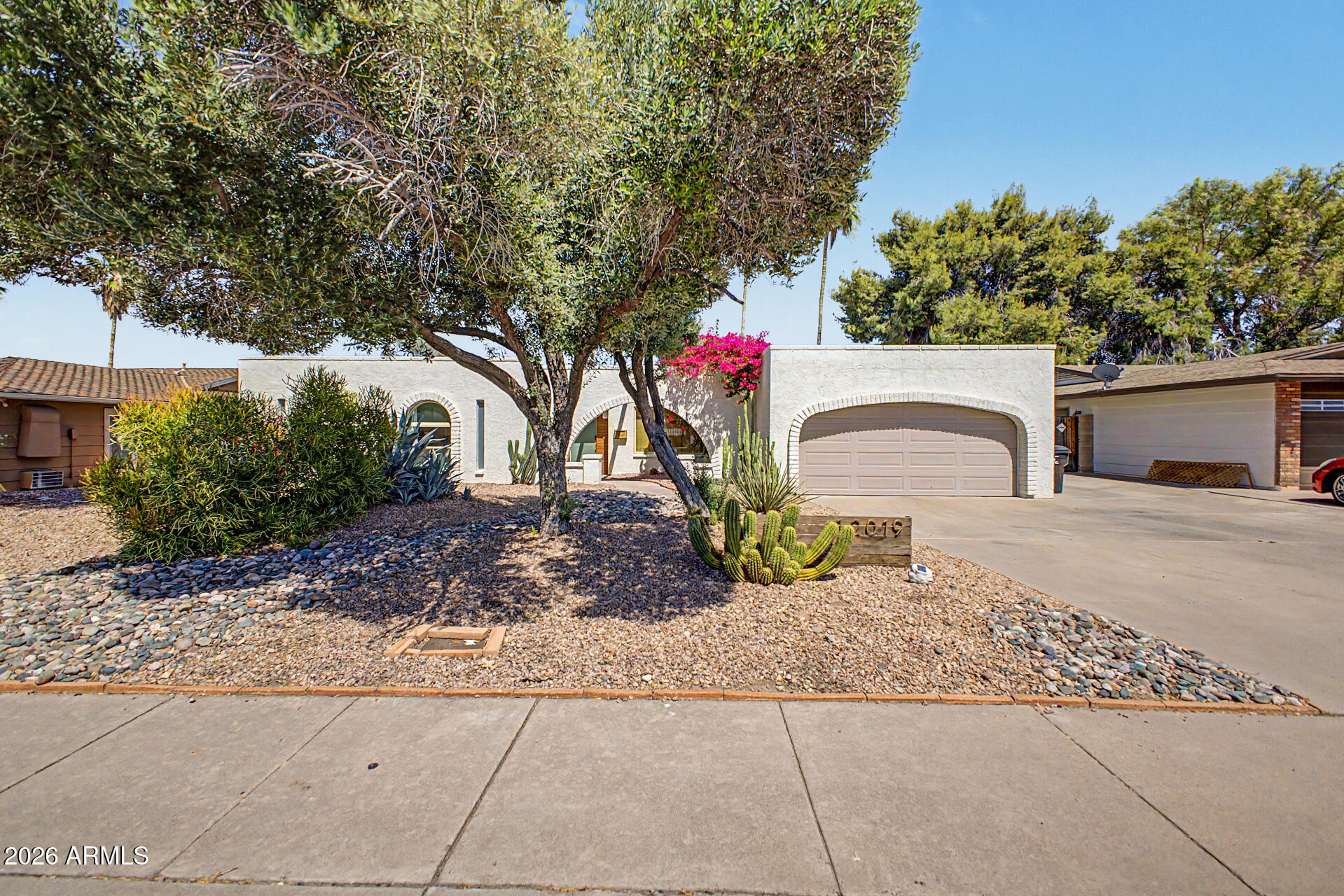 Beautifully remodeled single-story home with pool, RV gates, and no HOA in North Phoenix! Bright, inviting living spaces feature tile flooring, arched passageways, beamed ceilings, a cozy kiva fireplace, and abundant natural light throughout. The updated kitchen offers white shaker cabinetry, quartz countertops, tile backsplash, built-in appliances, and a peninsula with breakfast bar. The spacious primary suite includes a walk-in closet, private bath, and direct backyard access, while the living room also opens to the outdoor space. Enjoy a backyard oasis with a covered patio, sparkling pool, and room to relax or entertain. Conveniently located near the 51, shopping, dining, and hiking. Step outside to your own private backyard retreat designed for both relaxation and entertaining. Enjoy Arizona living year-round with a sparkling pool, expansive covered patio, and a charming ramada perfect for outdoor dining, hosting friends, or unwinding after a long day with your favorite drink in hand. The spacious backyard offers multiple areas to gather, lounge, and enjoy sunny afternoons or peaceful desert evenings. Whether you're entertaining guests or simply enjoying a quiet night at home, this outdoor space creates the perfect extension of the home's warm and inviting atmosphere.