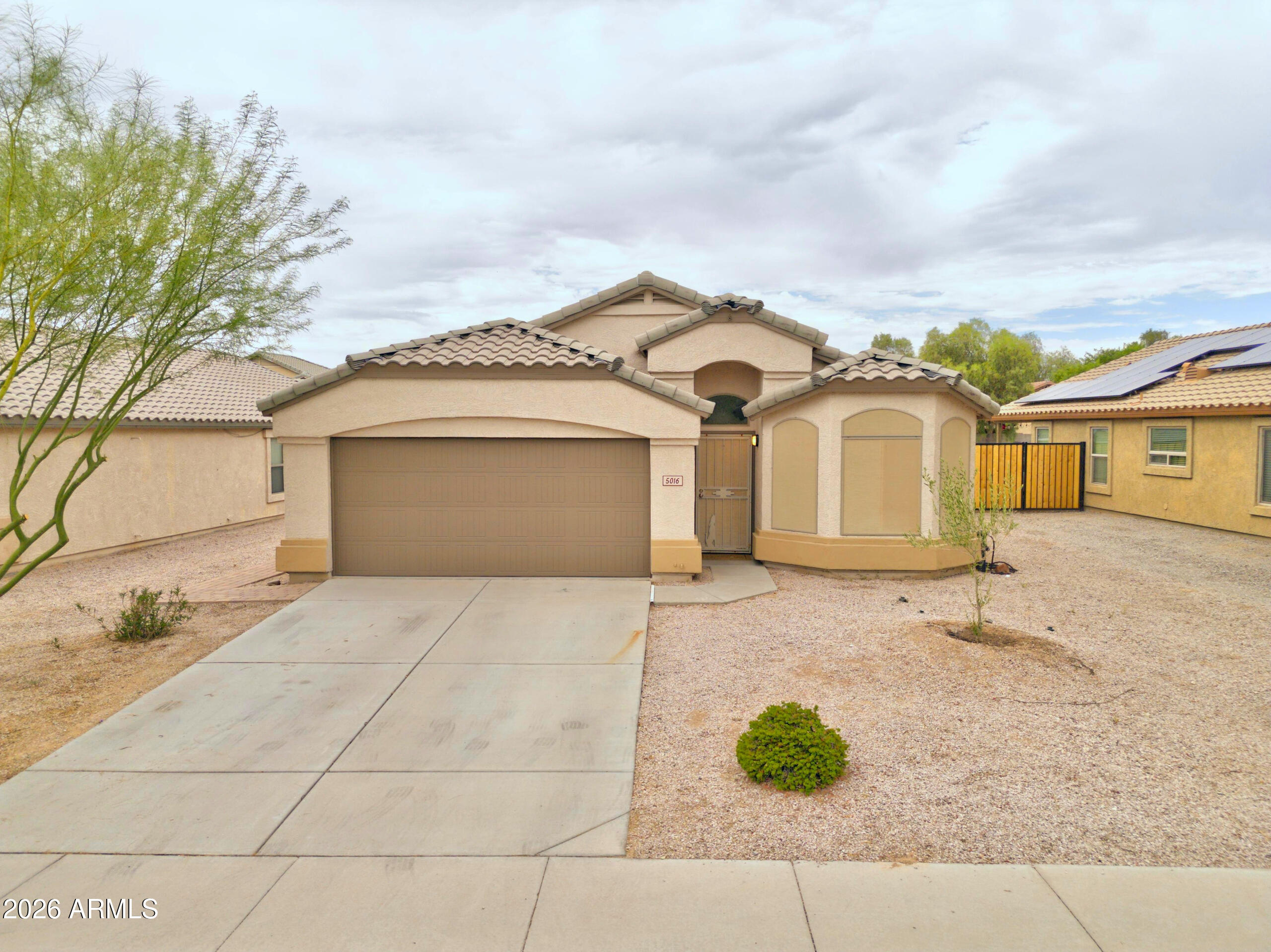 Beautiful 3-bedroom, 2-bath home featuring a spacious split floor plan and a large family room perfect for entertaining. The open kitchen offers ample cabinet space and overlooks the main living area. The primary suite includes a walk-in closet and private bath. Enjoy a low maintenance backyard with a covered patio, plus a 2 car garage and solar panels. Conveniently located near parks, schools, shopping, dining, and easy access to I-10. Don't miss this great opportunity!
