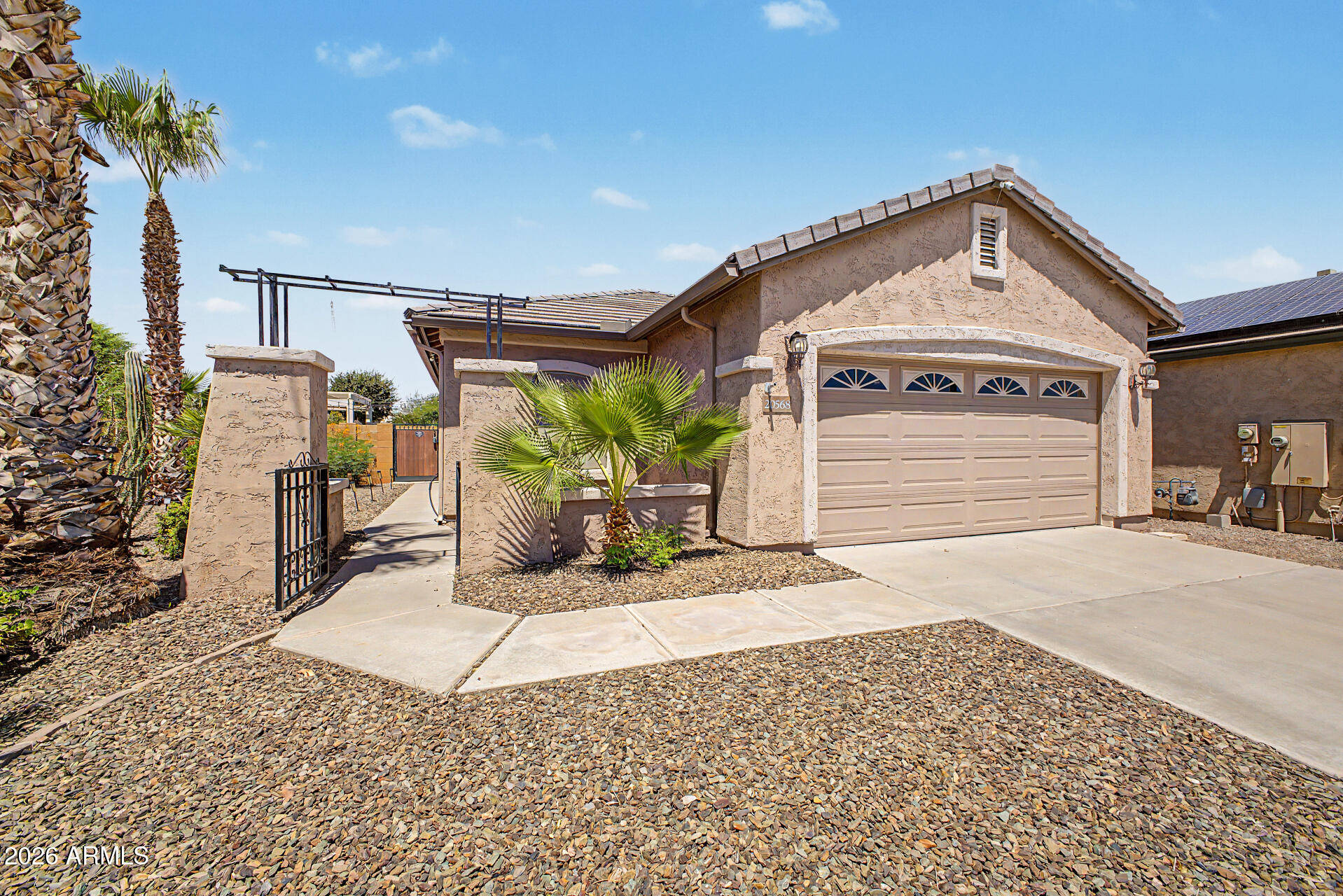 Beautifully maintained single-level home located on a quiet cul-de-sac in Festival Foothills. Featuring 3 bedrooms, 2 bathrooms, a split floor plan, and a fully landscaped backyard with a pool, this home is designed for comfortable living and entertaining. The garage screen provides added privacy and endless hours of enjoyment. Just a short walk to the community splash pad, parks, playground, basketball court, softball fields, covered ramadas, and BBQ areas. Conveniently located within walking distance of the elementary school and offering direct access to I-10 and Loop 303. Only 30 minutes from TSMC, this home combines comfort, convenience, and an outstanding location.