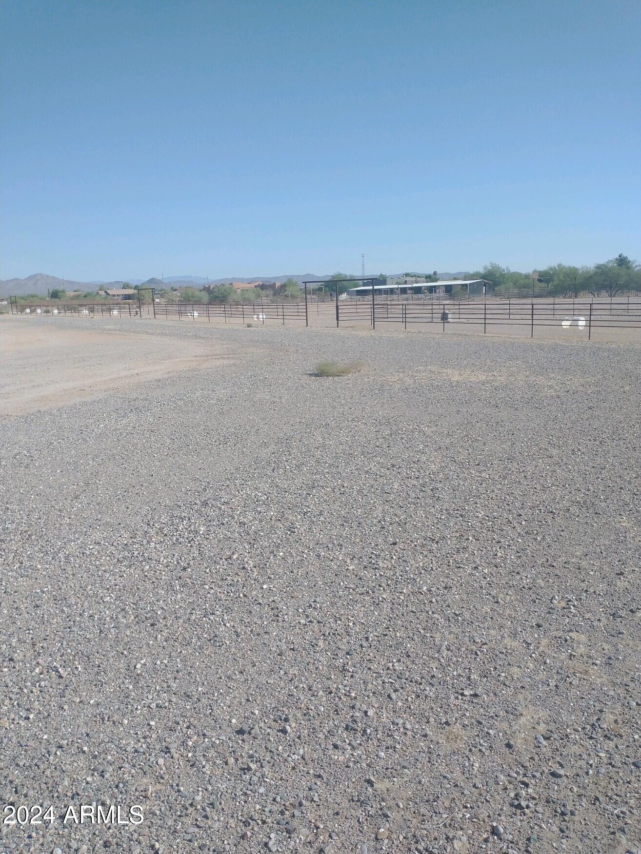High-end area, with site-built homes and large horse set ups surrounding property. 
Very nice 20 Acre Tract which has been partial leveled in preparation for Home Site, Barns and Arena set-up. There are Easements both from the South and North into property.  Property is totally fenced with Pipe fencing also included is  4- 100' X 220'' pipe horse pens.
Close to Wickenburg and Surprise.
