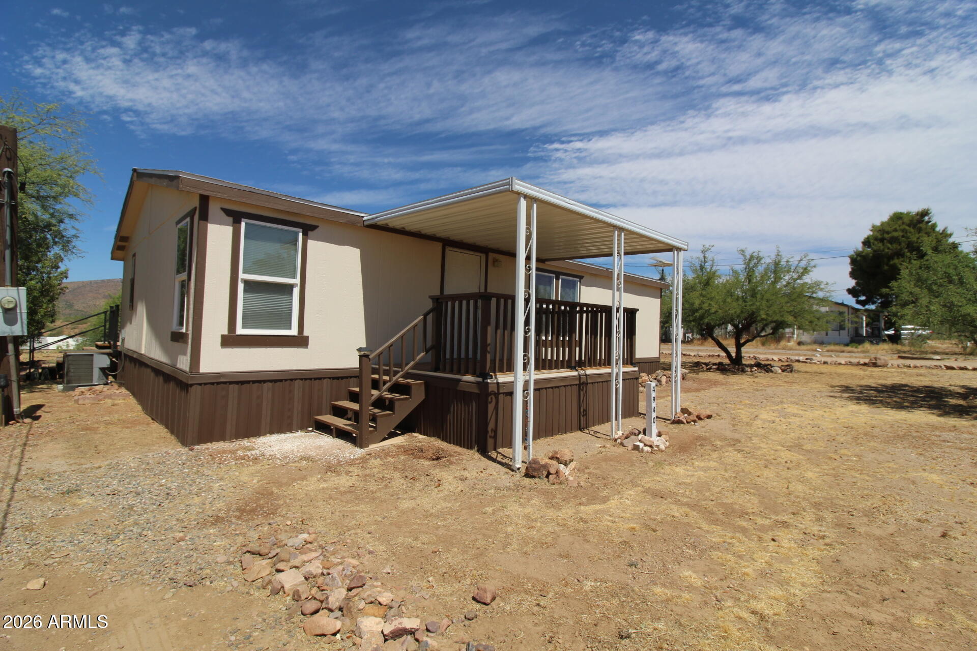 Well-maintained 3-bedroom, 2-bath manufactured home situated on just under half an acre with beautiful mountain views. This move-in-ready property features new windows and a newer HVAC unit, offering improved energy efficiency and year-round comfort. Enjoy the surrounding scenery from the newer rear deck, the perfect spot to relax or entertain. Additional features include two storage sheds for extra storage, a covered carport for protected parking, and plenty of outdoor space to enjoy. Combining comfort, functionality, and scenic views, this property is ready to welcome its next owner.