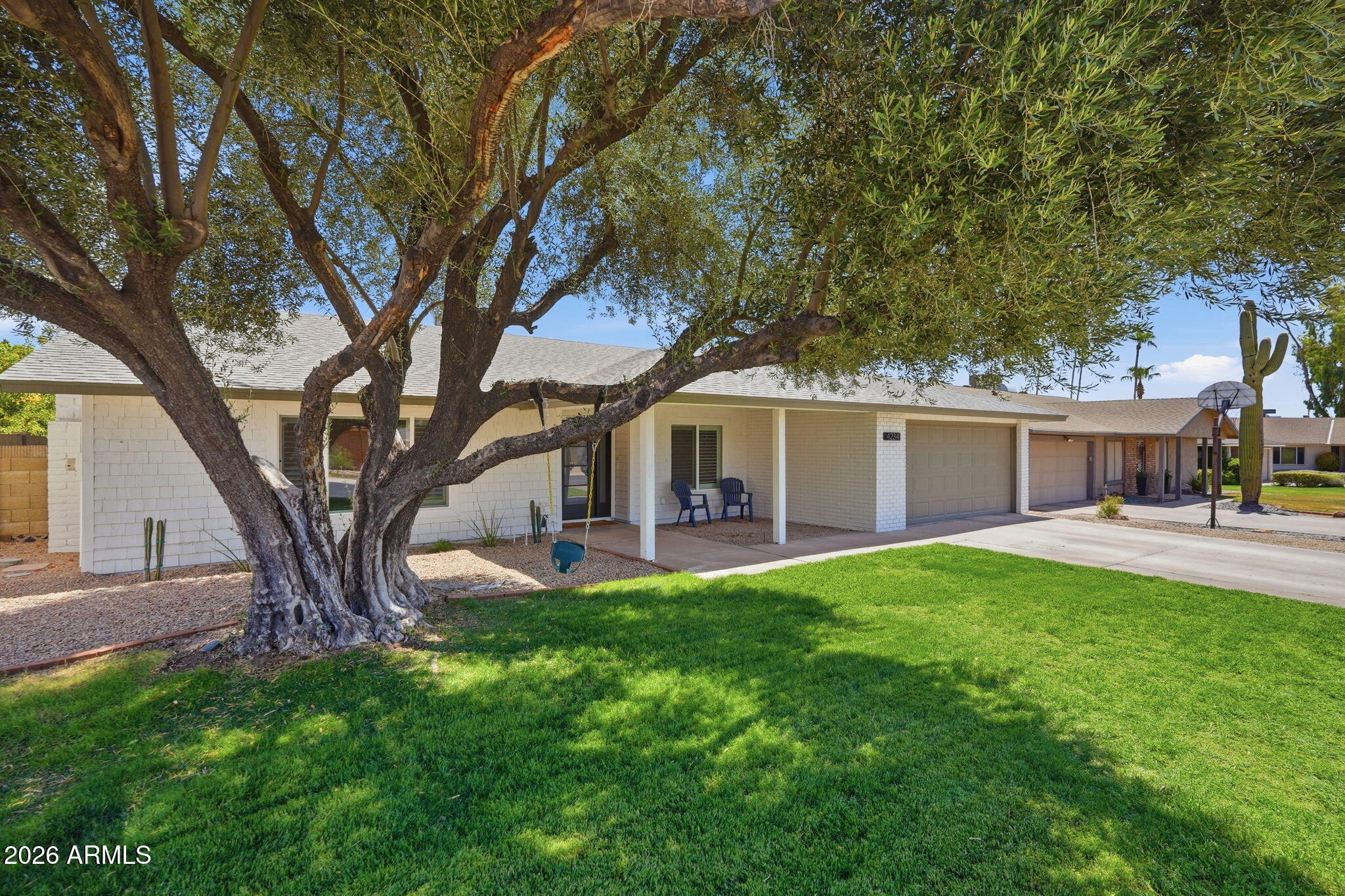 Mountain views, unforgettable Arizona sunsets, and direct greenbelt access to the golf course create the perfect backyard escape. Beautifully remodeled from top to bottom, this move-in ready home blends comfort and style with waterproof luxury vinyl plank flooring, quartz countertops, custom soft-close cabinetry, stainless steel appliances, dual-pane windows, fresh interior paint, updated baths, and a newer roof. Enjoy year-round outdoor living with a Pebble Tec pool, heated spa, fireplace, and desirable north/south exposure. Located in the sought-after Kyrene School District with a very low HOA, this home captures the best of Arizona living.