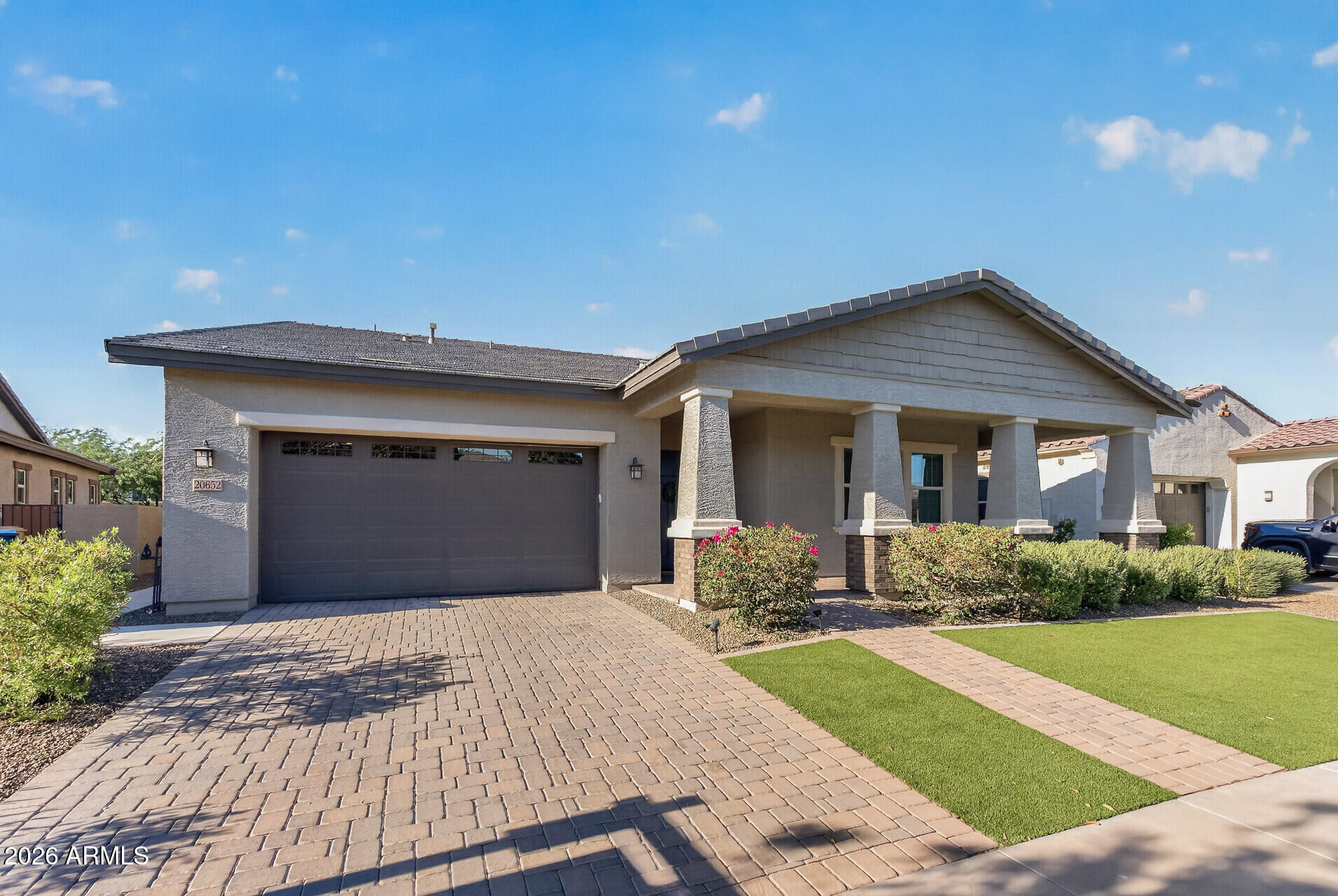 Welcome to Victory at Verrado -- a master-planned active adult community in Buckeye! This beautiful single-story home offers updated kitchen, stainless steel appliances, gas cooktop, large island, staggered shaker white cabinetry, walk-in pantry & double ovens. Tile is throughout living spaces & baths. Dining room has a slider to the back yard, as well as, the living room. Master bedroom is in the back of the home with a stunning master bath retreat, including walk-in tile shower & dual vanity sinks. Guest bath has a tile shower as well. Back yard has open view fence with view. Enjoy resort-style living with two championship golf courses, community pools, pickle ball courts, state-of-the-art fitness centers, plus close to dining and shopping. Nearby medical facilities & hospitals.