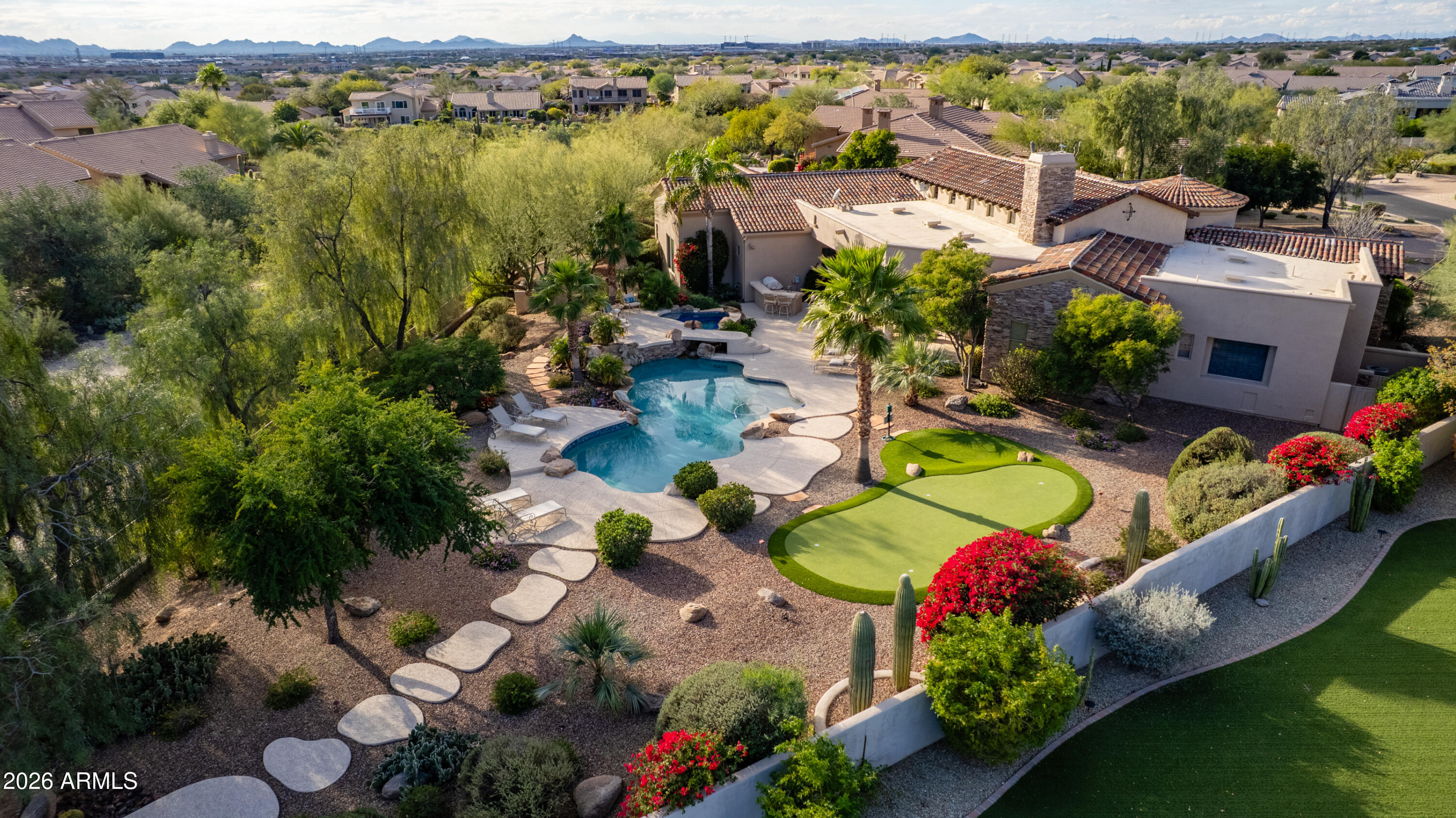 Nestled within the charming 23-home, all single-story gated enclave of Toscana, this desirable ranch estate is a true North Scottsdale jewel and one of the area's best-kept secrets. Set on an exceptional oversized lot, the home enjoys picturesque McDowell Mountain backdrop views and shimmering city light vistas, offering a rare sense of space, privacy, and presence within this intimate, one-level community. Ideally located immediately south of DC Ranch, the setting combines prestige, tranquility, and convenience.

Designed for effortless living and entertaining, this meticulously maintained, one-owner residence offers a highly desirable floor plan featuring four bedrooms plus a den, thoughtfully arranged with a split owner's suite. Spacious living areas form the heart of the home, creating a seamless flow that enhances both everyday comfort and entertaining ease.

Seamless indoor-outdoor living defines the lifestyle, with living spaces opening to a resort-style backyard that feels like a private retreat. Outdoors, enjoy an expansive covered patio, multiple lounging and entertaining areas, a putting green, fire pit, and a sparkling pool and spaperfect for relaxed afternoons or elegant evenings under the desert sky. The oversized lot provides exceptional space and privacy, elevating the sense of resort living in the heart of North Scottsdale.