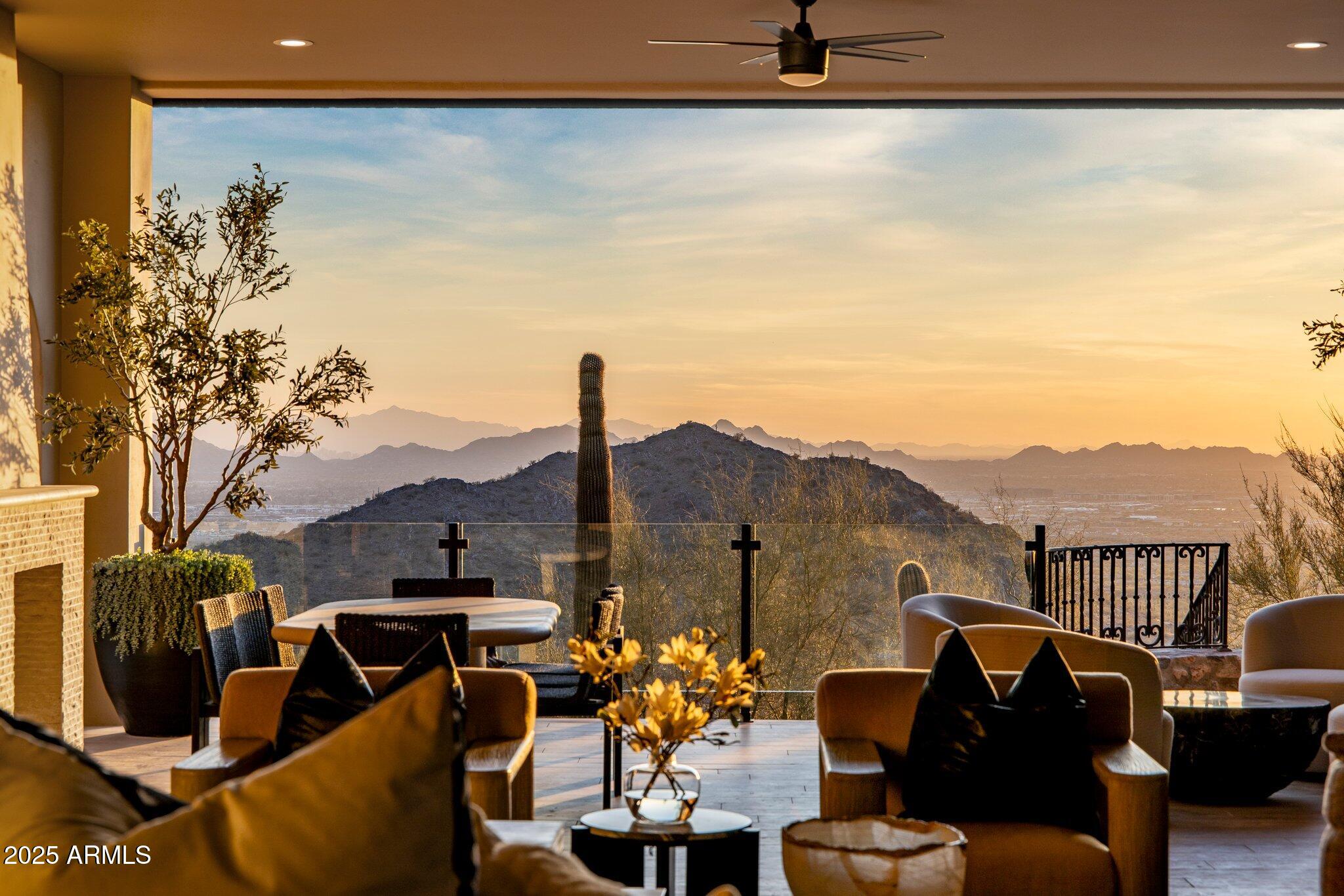 *Temporarily off market. ER in place. SILVERLEAF GOLF MEMBERSHIP OPPORTUNITY!
Modern Luxury with Breathtaking Views in Silverleaf's Upper Canyon. Nestled into the mountainside on an ultra-private 8+ acre cul-de-sac lot, this meticulously reimagined estate in the prestigious Upper Canyon of Silverleaf is a true masterpiece of modern luxury. Boasting 9,498 square feet of exquisite living space, this residence seamlessly blends sophisticated design with Arizona's signature indoor-outdoor lifestyle. Offering sweeping panoramic views of twinkling city lights, dramatic sunsets, and the lush Silverleaf golf course. Designed for both grand entertaining and intimate living, the estate features five ensuite bedrooms, including a primary suite on the main level with a private balcony framing breathtaking vistas. The boutique-style custom closets complement the spa-inspired primary bath, adorned with custom-lit quartzite countertops and exquisite designer finishes in addition to two water closets.
The heart of the home is the gourmet kitchen, a chef's dream with top-of-the-line appliances, quartzite islands, a butler's pantry, and custom designer lighting. This space flows effortlessly into the great room, where soaring ceilings and disappearing glass doors open to an inviting outdoor lounge. A dual-sided fireplace serves as a striking focal point, seamlessly connecting the great room to a modern parlor room -a sophisticated space perfect for entertaining, unwinding, or hosting an intimate dinner.
Multiple courtyards, fountains, and serene outdoor seating areas enhance the estate's ambiance, while the resort-style saltwater pool and outdoor kitchen create the ultimate desert oasis.
Additional highlights include a dedicated office (or optional sixth bedroom), a state-of-the-art gym, a game room, and a 456-square-foot detached casita/pool house. For the car enthusiast, the expansive garage accommodates 6 vehicles, room for 2 lifts, offering both functionality and luxury.
In 2024, this estate underwent a multi-million-dollar renovation, elevating every detail with the finest materials, designer lighting, custom finishes and sparkling new pool.