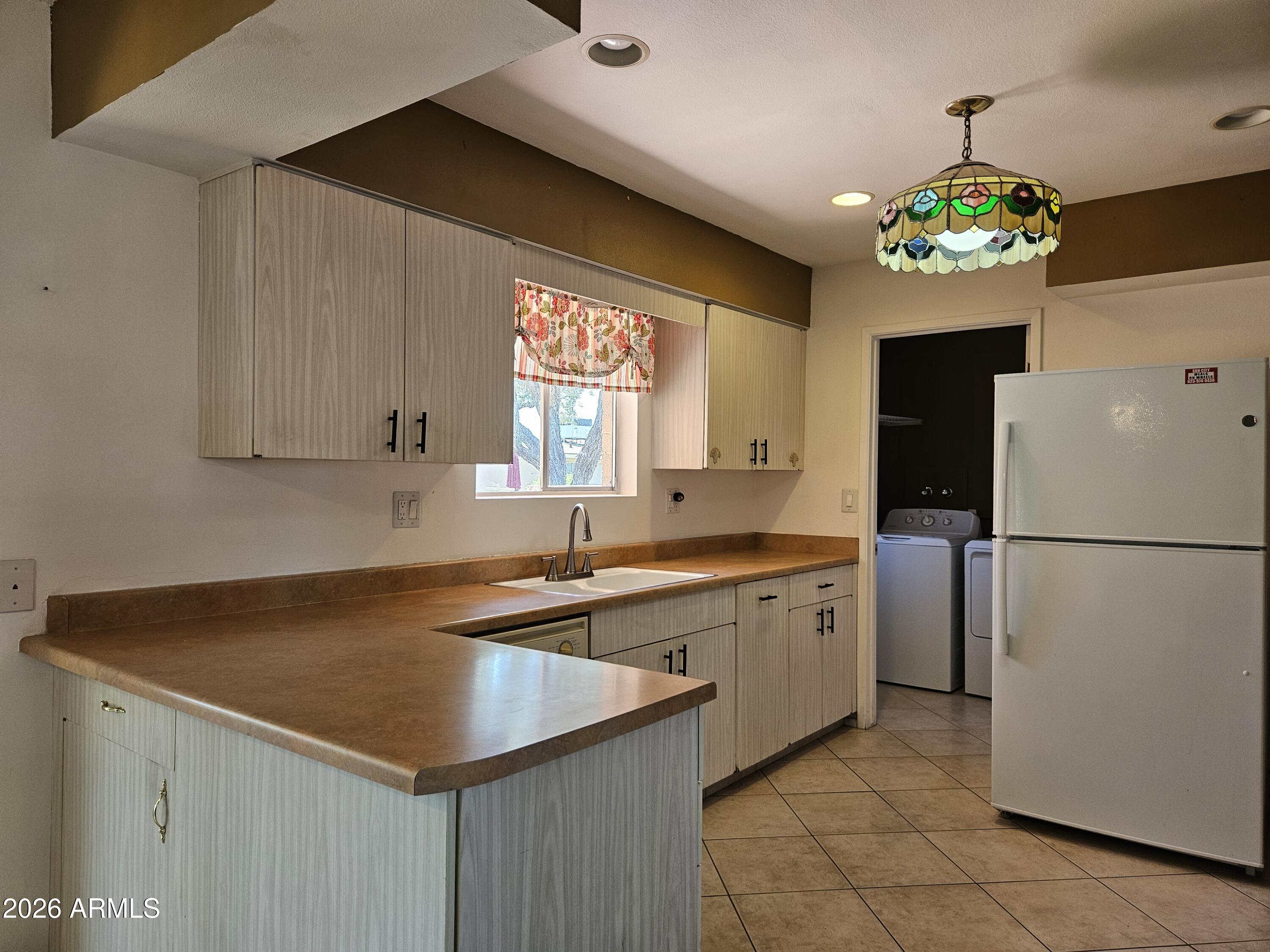 Close to the Fairway Center and South Golf Course. This charming condo offers spacious living with a gorgeous brick exterior that adds timeless curb appeal. Step through the gated front courtyard--perfect for morning coffee or welcoming guests--into a warm and inviting home designed for comfort and convenience.
Inside, you'll find two generously sized bedrooms and two full bathrooms, providing the ideal layout for both relaxation and privacy. The bright eat-in kitchen offers plenty of space for casual dining and everyday living, while the inside laundry room adds extra convenience.
An enclosed patio creates the perfect sunroom retreat, where you can unwind and enjoy peaceful views of the backyard year-round. Whether you're entertaining or simply enjoying a quiet evening at home, this delightful condo is ready for its new owners to move in and make it their own!