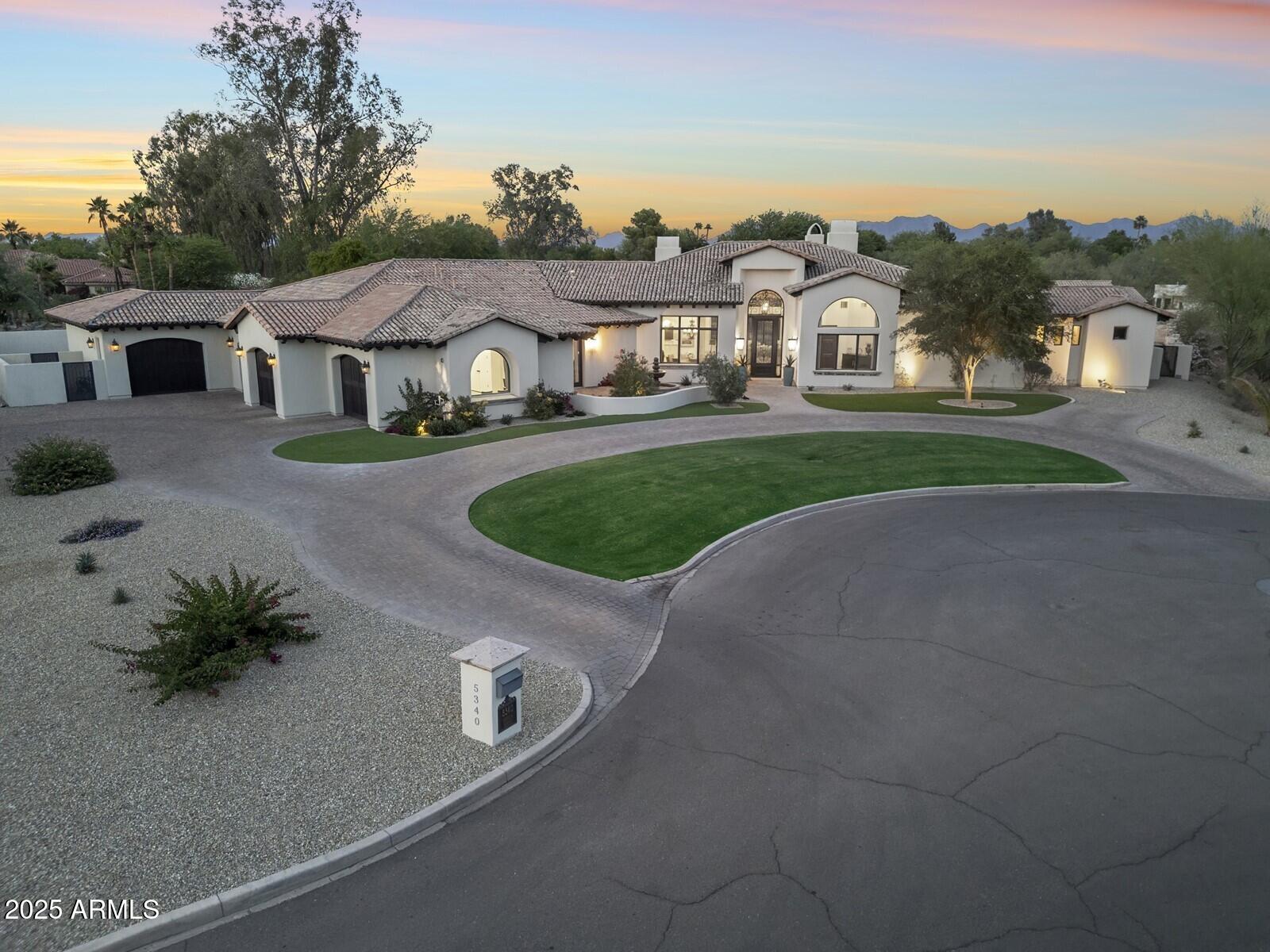 A rare offering in Paradise Valley's most coveted neighborhoods, this elegant Santa Barbara-style estate with a 1,000 sq ft detached guest house blends timeless charm with modern sophistication. The main residence features 4 en-suite bedrooms, a separate office, game room, and a chef's kitchen with Wolf/Sub-Zero appliances, large island, and breakfast nook. The detached guest house includes a private entry, living area, bedroom, and kitchenette. Outdoors, enjoy a resort-style pool, spa, sport court, expansive green space, and covered patios, perfect for entertaining. Walking distance to Cherokee Elementary and just minutes from upscale dining, shopping, and resorts. Don't miss this one!