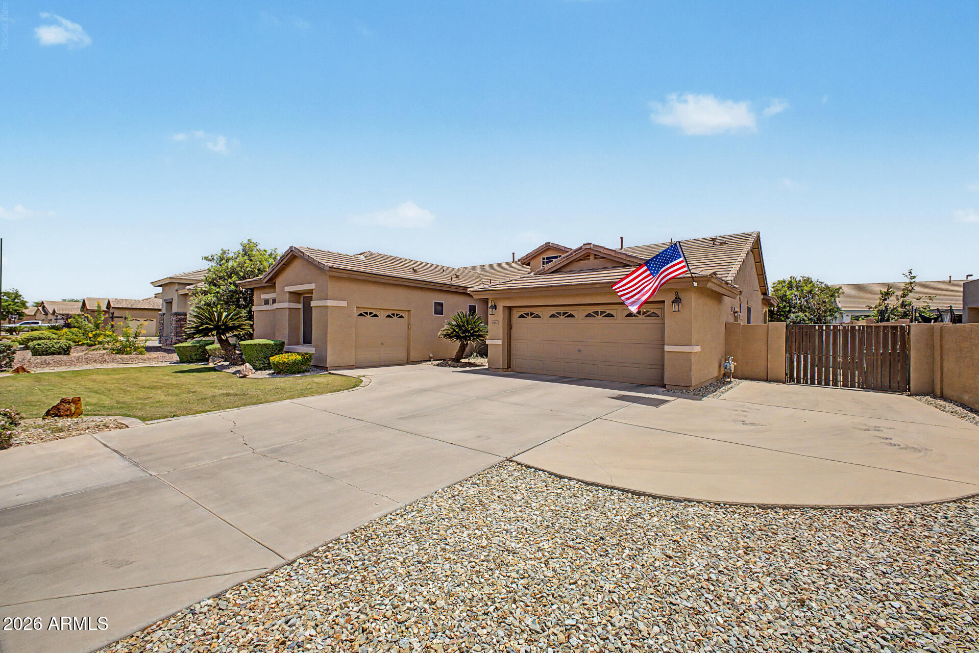Hard-to-find single level Gilbert home with a 3 car garage, updated kitchen, and major system upgrades already completed. This 3 bedroom, 2 bathroom home offers a functional split floor plan with an open-concept layout connecting the living, dining, and kitchen areas--ideal for everyday living and entertaining. Fresh interior paint and natural light give the home a bright, clean feel throughout, with shade screens on the windows to optimize the home's interior against the desert heat. The kitchen is a standout feature, offering granite countertops, stainless steel appliances, extensive cabinetry, and a rare double island that adds both workspace and seating. The primary suite is privately located and includes a walk-in closet and an en-suite bath with updated finishes. A separate den provides flexibility for a home office, guest space, or additional living area. Major updates include a BRAND NEW roof with a 30-year warranty, a 2023 main AC unit, and a newer water heater, offering long-term peace of mind. The backyard is designed for usability and privacy, featuring a full-width covered patio, grassy area, mature fruit trees (orange and blood orange), and extra side yard space. Out front, find extra driveway space and a double-wide gate. Surrounded by single-story homes, the setting feels more open and private. Located in a well-established Gilbert neighborhood near parks, shopping, dining, and freeway access, this home combines a desirable layout, key upgrades, and plenty of storage throughout the home and garage.