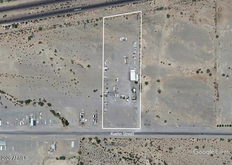 9.45 Ac Right on Interstate 10. 40+ Spaces 50amp/Water/Sewer, 15-20 Spaces Electric Only, 20 Vendor Locations w/6 of them being Premium 60' x 20' Spaces w/Electric on Kuehn Avenue. Several Dry Camping Spaces at the Northend of the Property...Room for Adding Utilities. 1-80'x 40' Metal Building w/Roll-Up Doors. 1-40' x 8' Railroad Car for Storage. Great Location Only 2-Blocks from the Big Tent RV Show & the Internationally Recognized Rock & Gem Show which runs from November 1st through April 1st Each Year. Seller may Carry with 50% Down at 7% Int-Only on a 2-Yr Balloon.  Property has been used for the past 4 years by an APS Contractor for the Storage of Heavy Equipment at the Northend of the Property.  All Equipment has been Sold/Removed. Profit/Loss available for Qualified Buyers